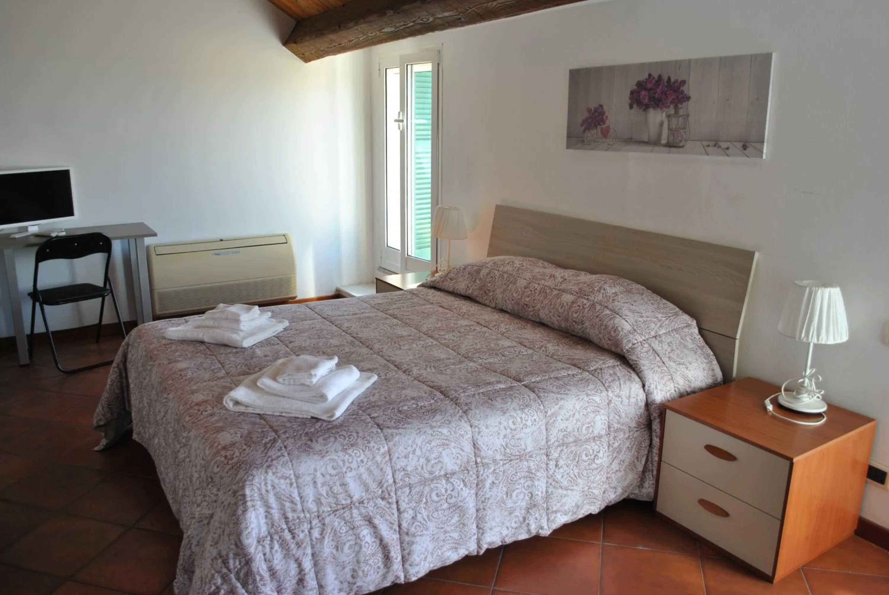 Bed in Il Giardino dei Limoni Room & Apartments