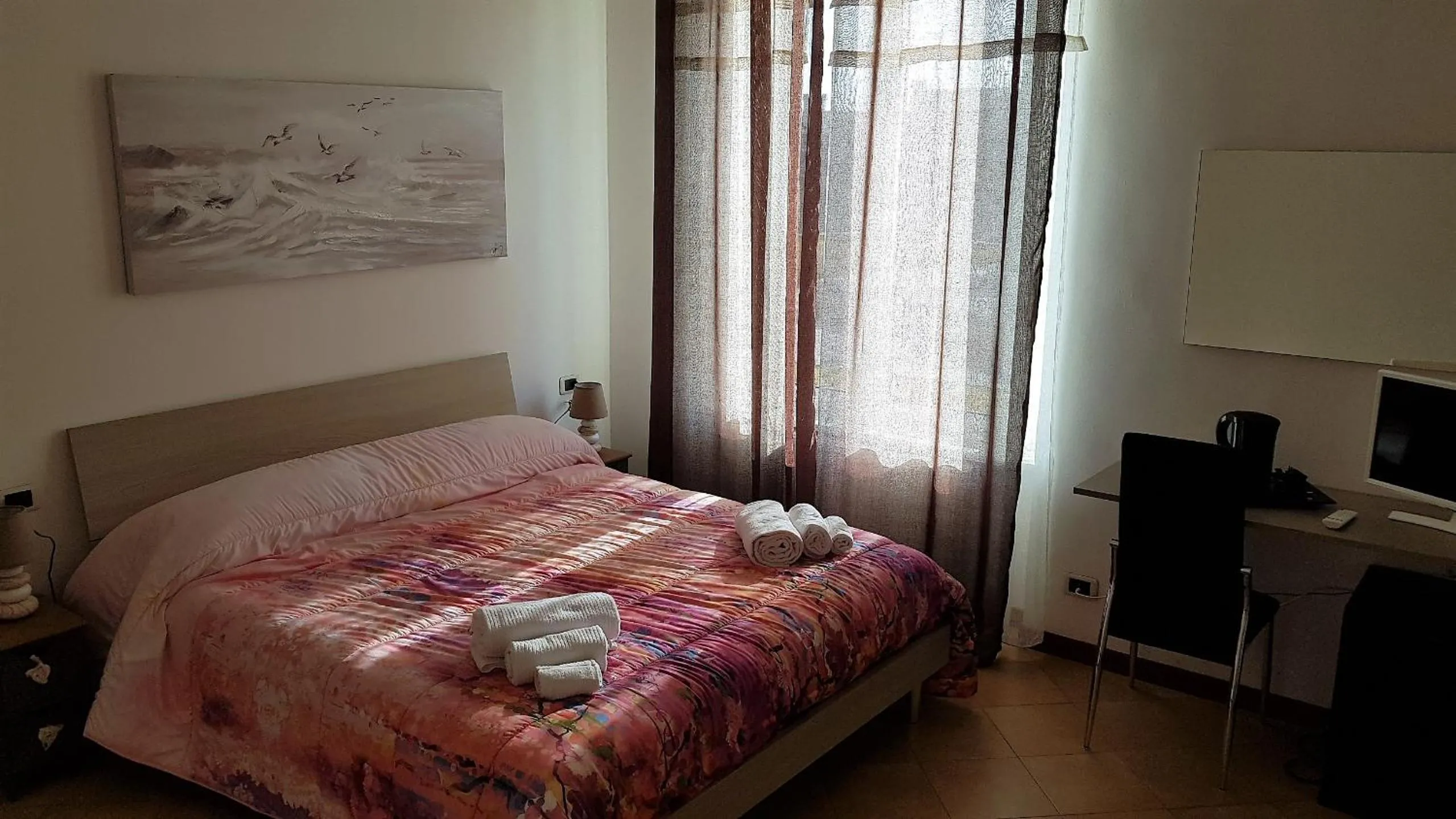 Bed in Il Giardino dei Limoni Room & Apartments