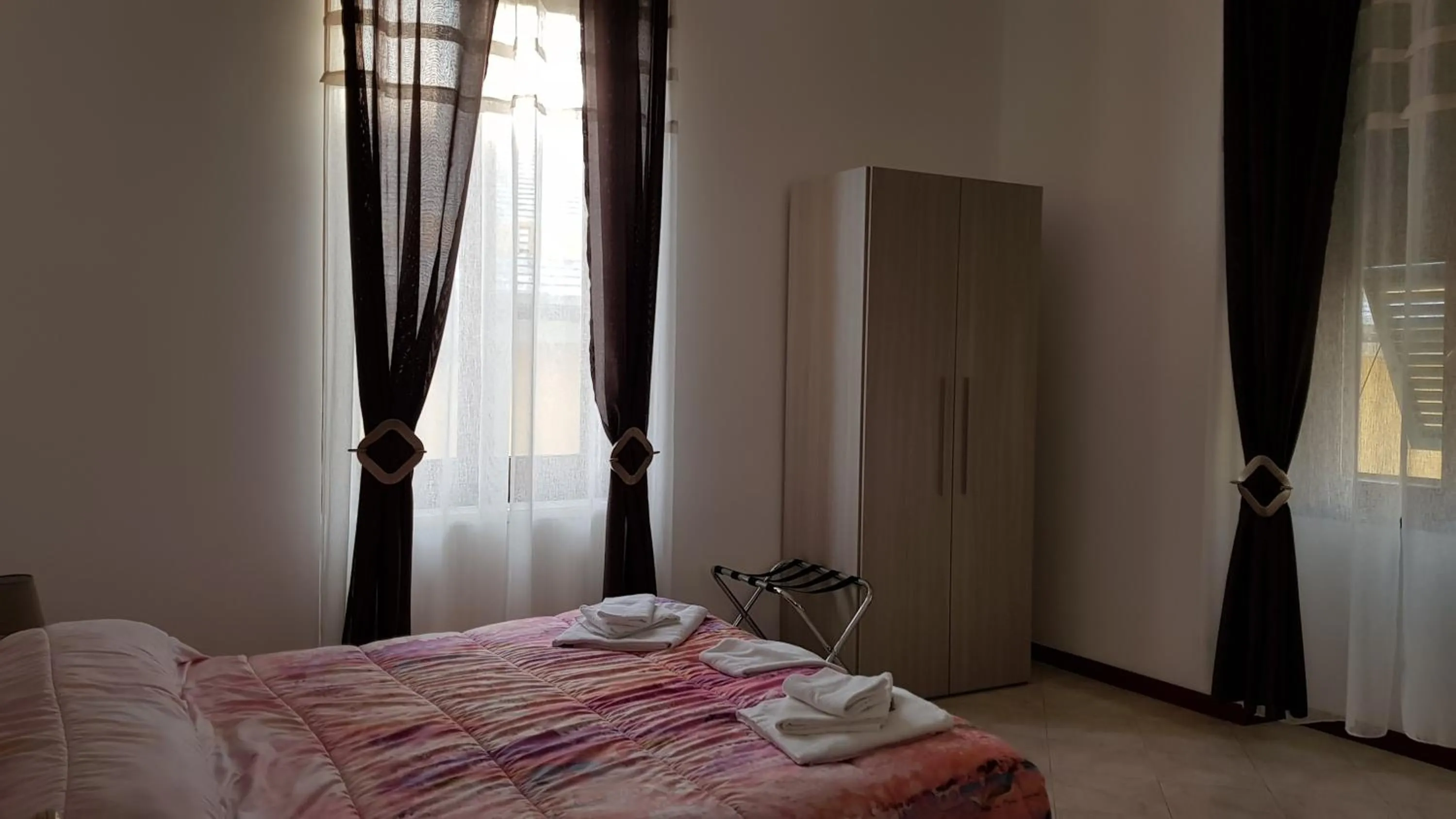 Bed in Il Giardino dei Limoni Room & Apartments