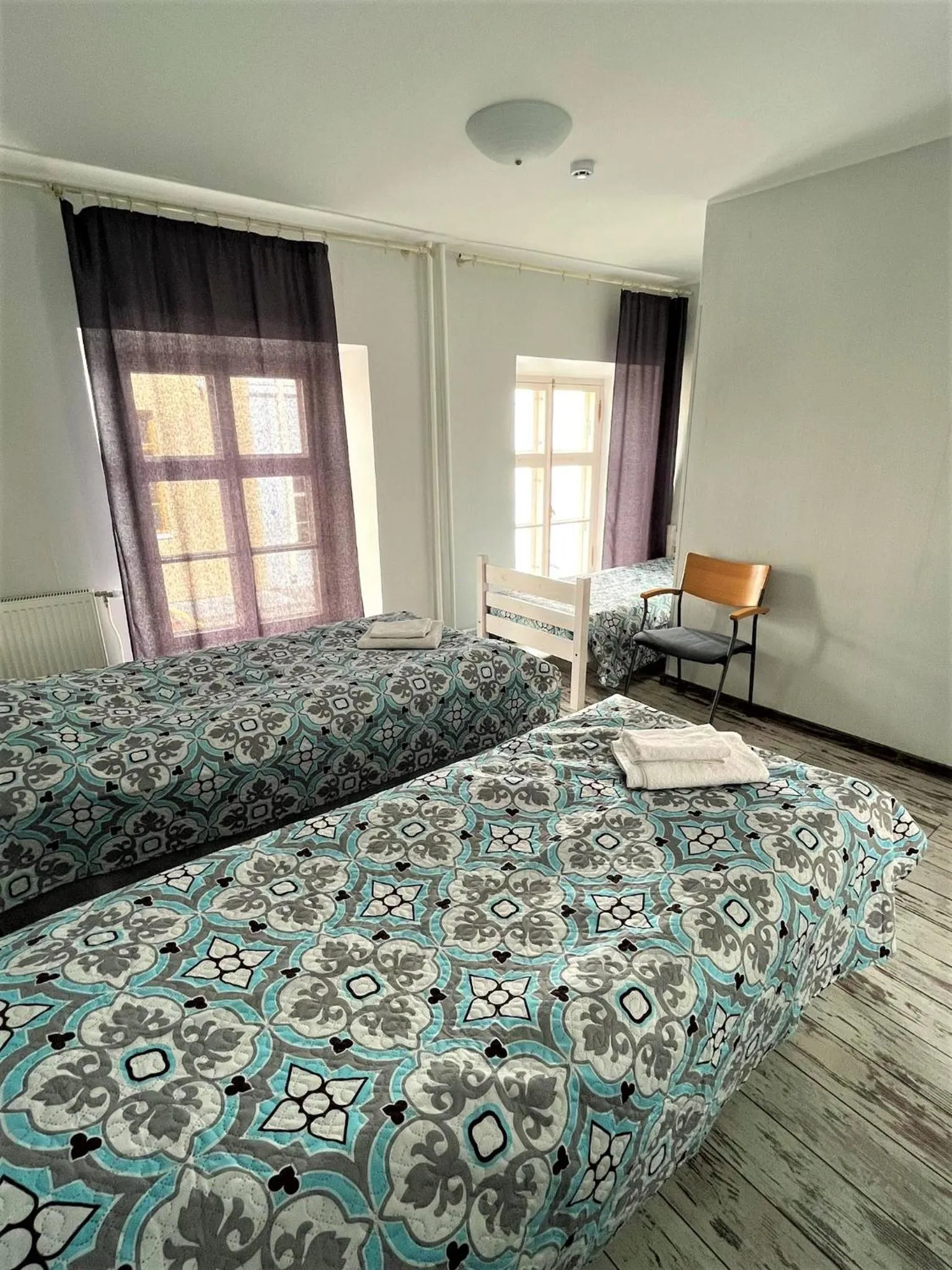 Bed in Godart Rooms Guesthouse