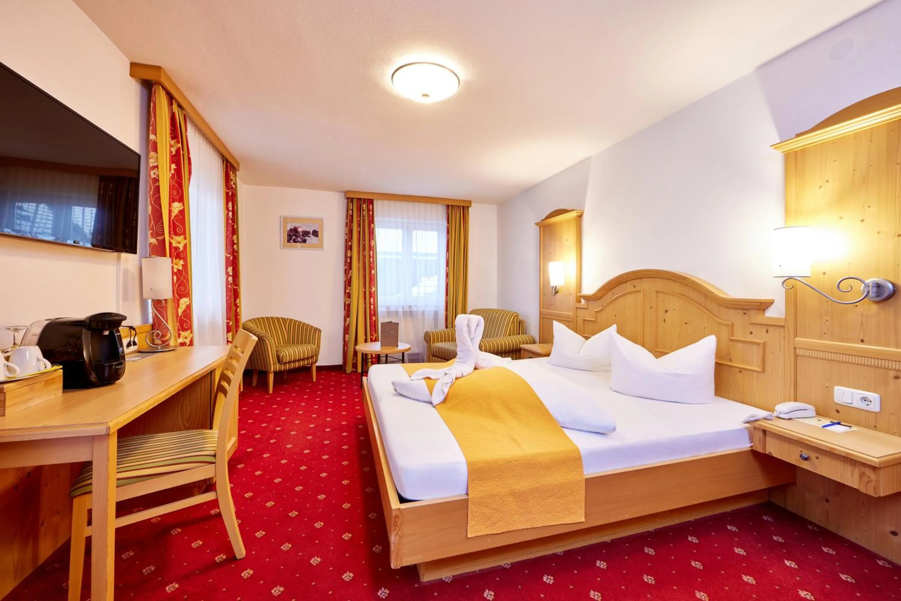 Bed in Alpenhotel Rieger