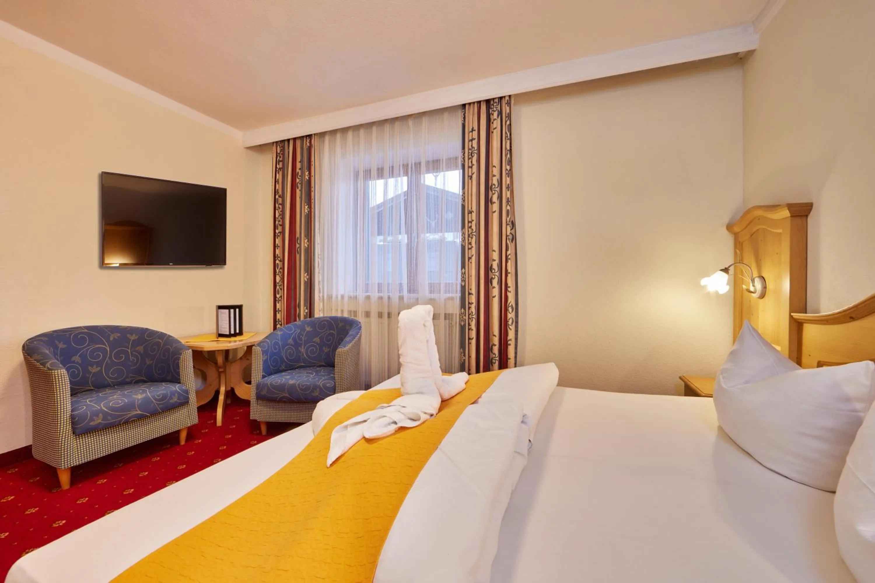 Bed in Alpenhotel Rieger