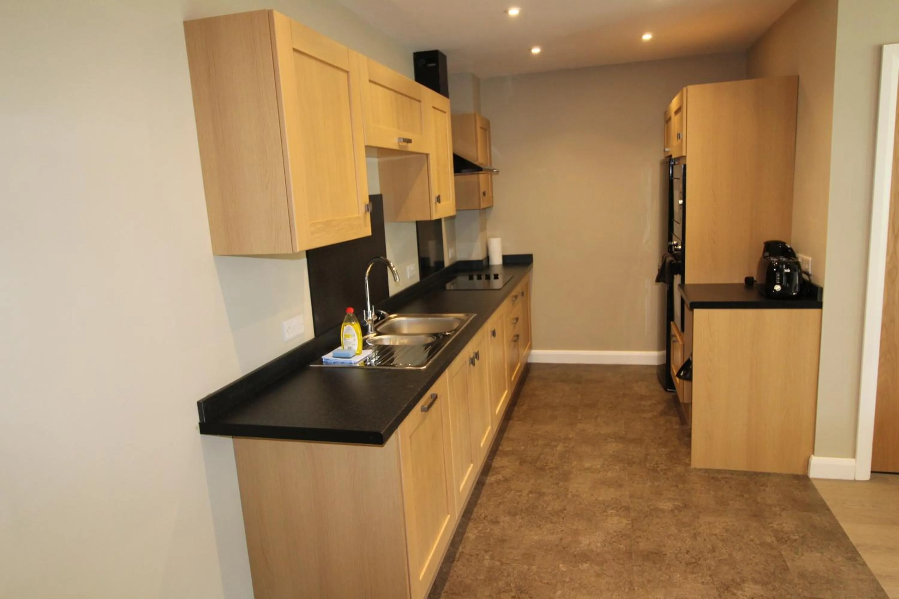 Kitchen or kitchenette in Plawsworth Hall Serviced Cottages and Apartments