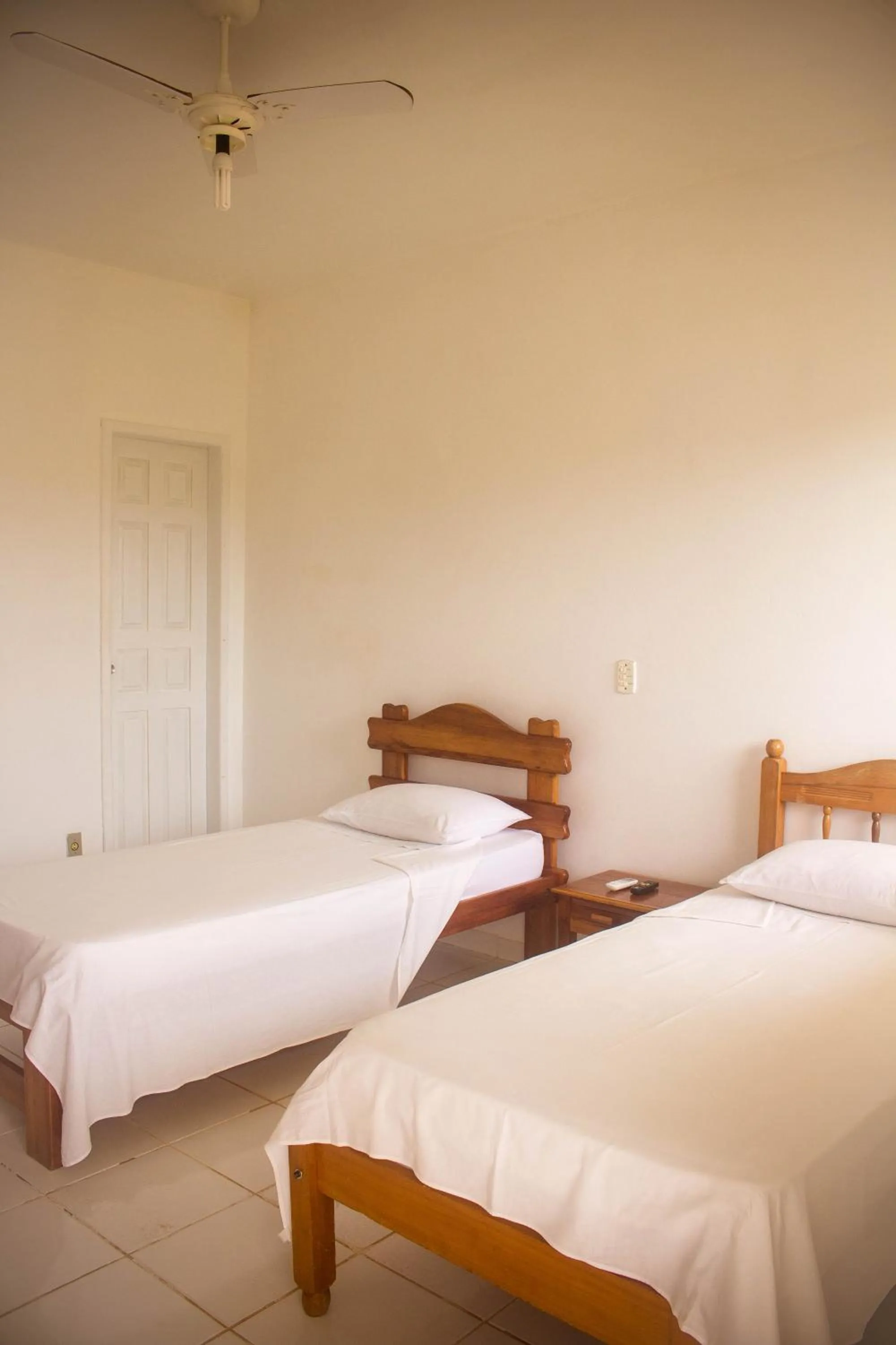Bed in Pousada Pau Brasil