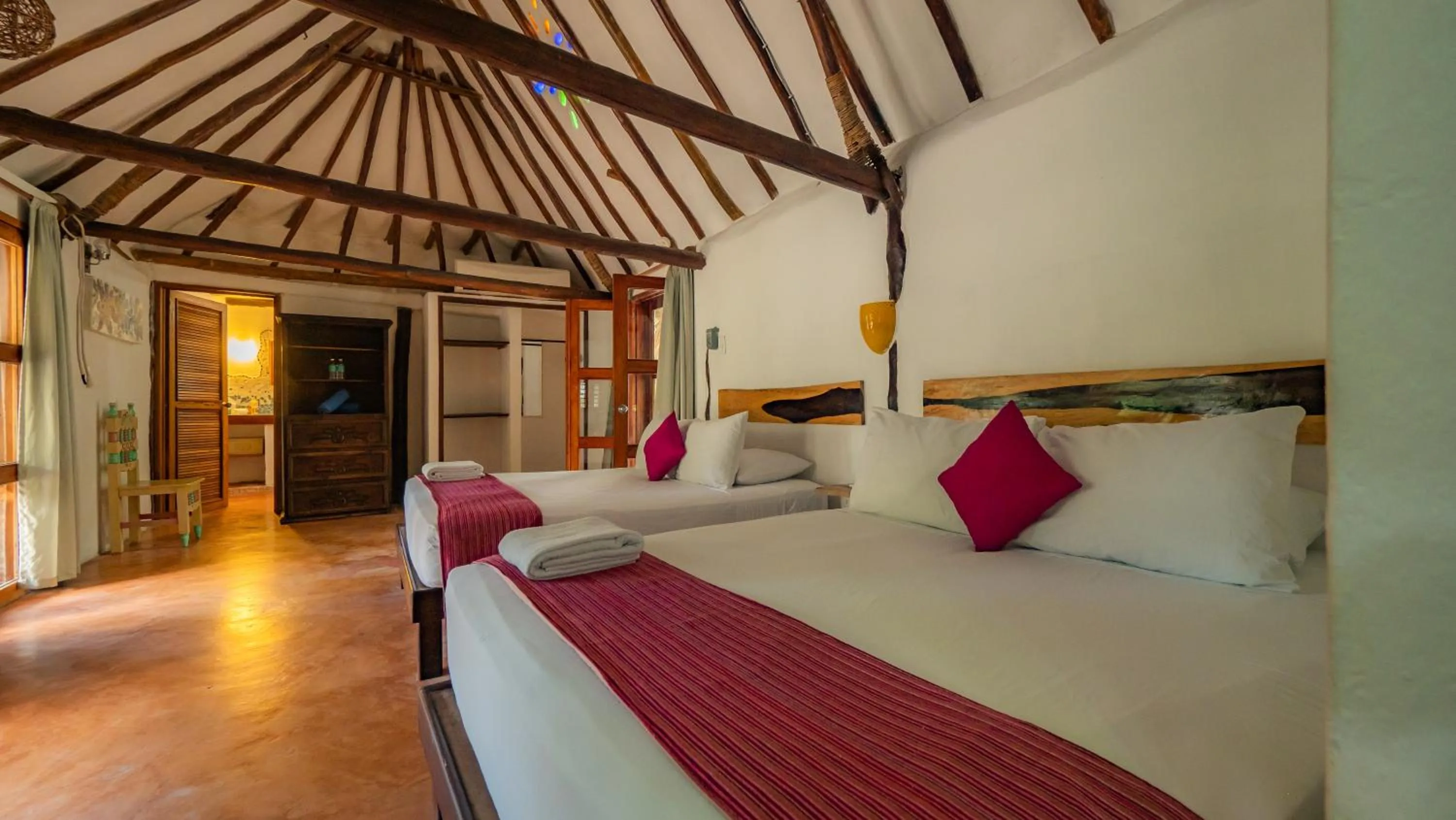 Bed in Zomay Beachfront Holbox