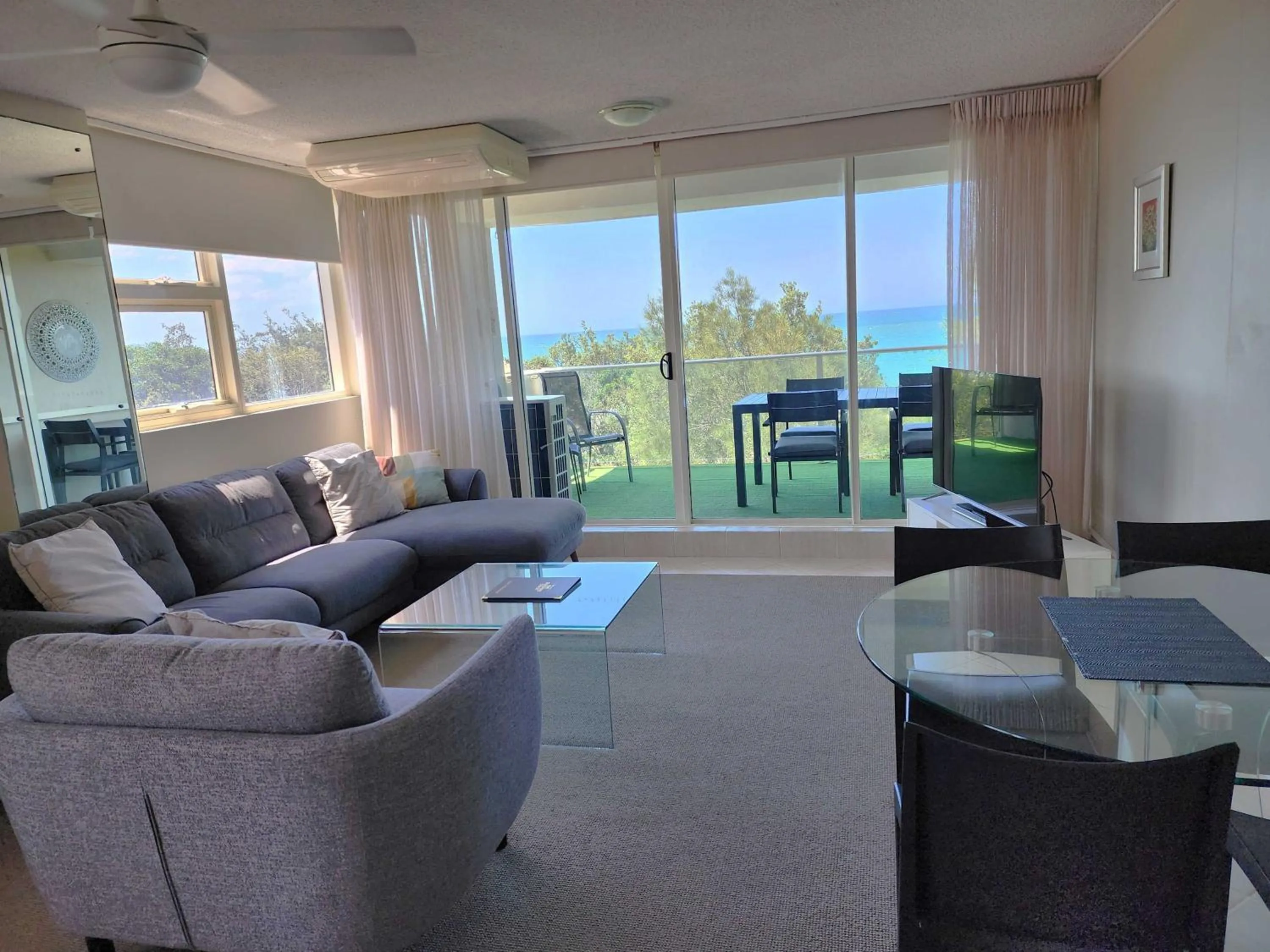 Living room in 84 The Spit Holiday Apartments