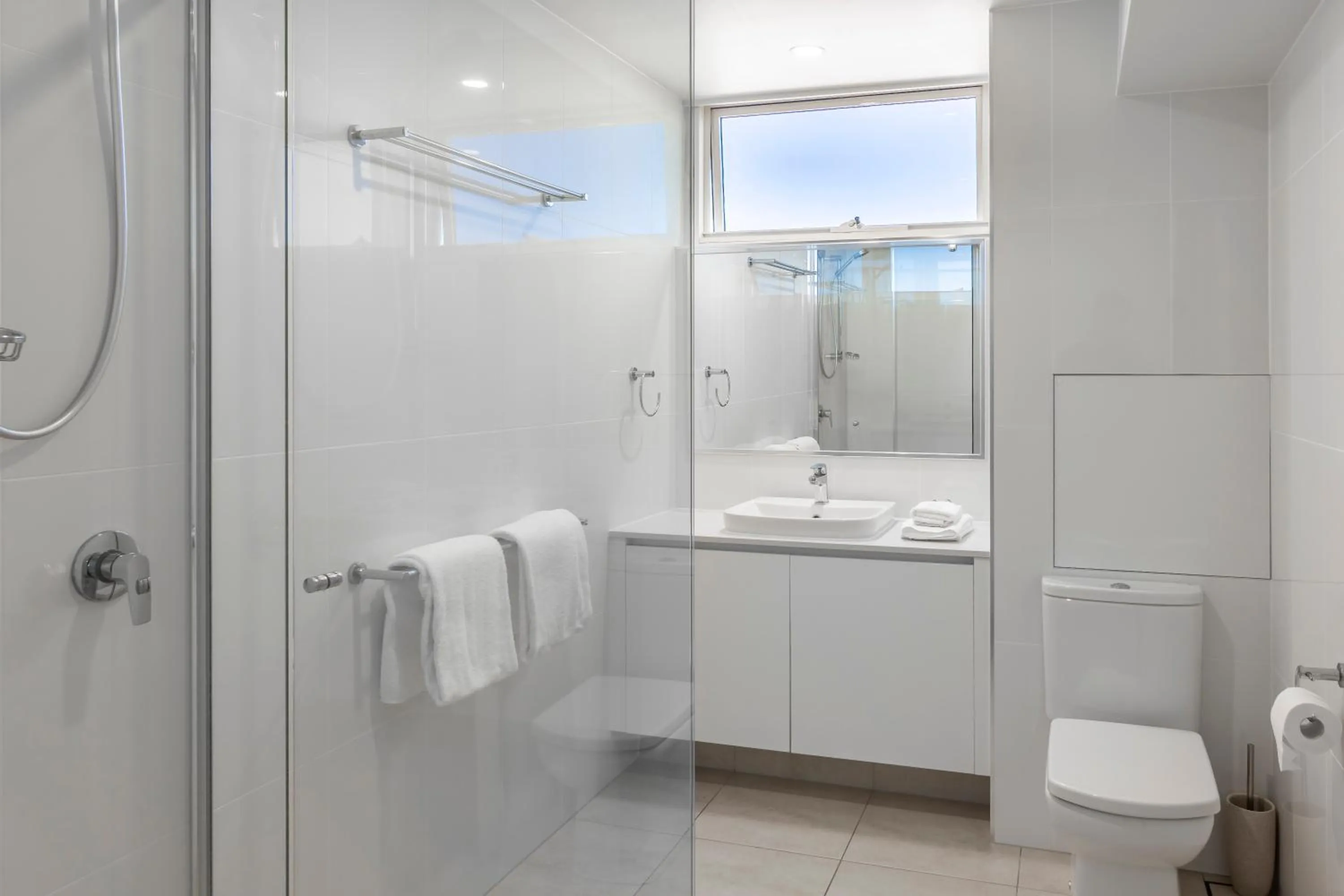 Bathroom in 84 The Spit Holiday Apartments