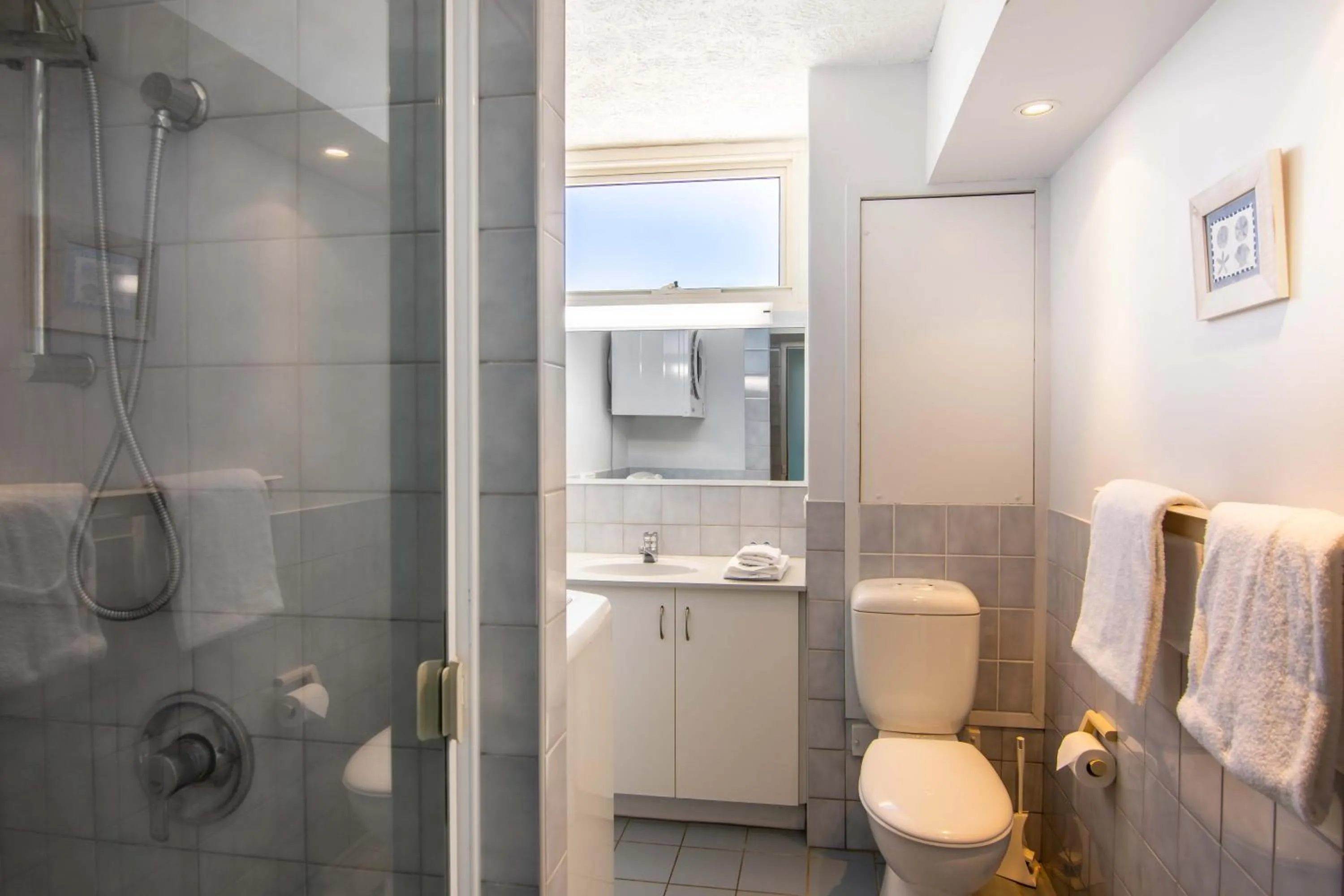 Shower in 84 The Spit Holiday Apartments