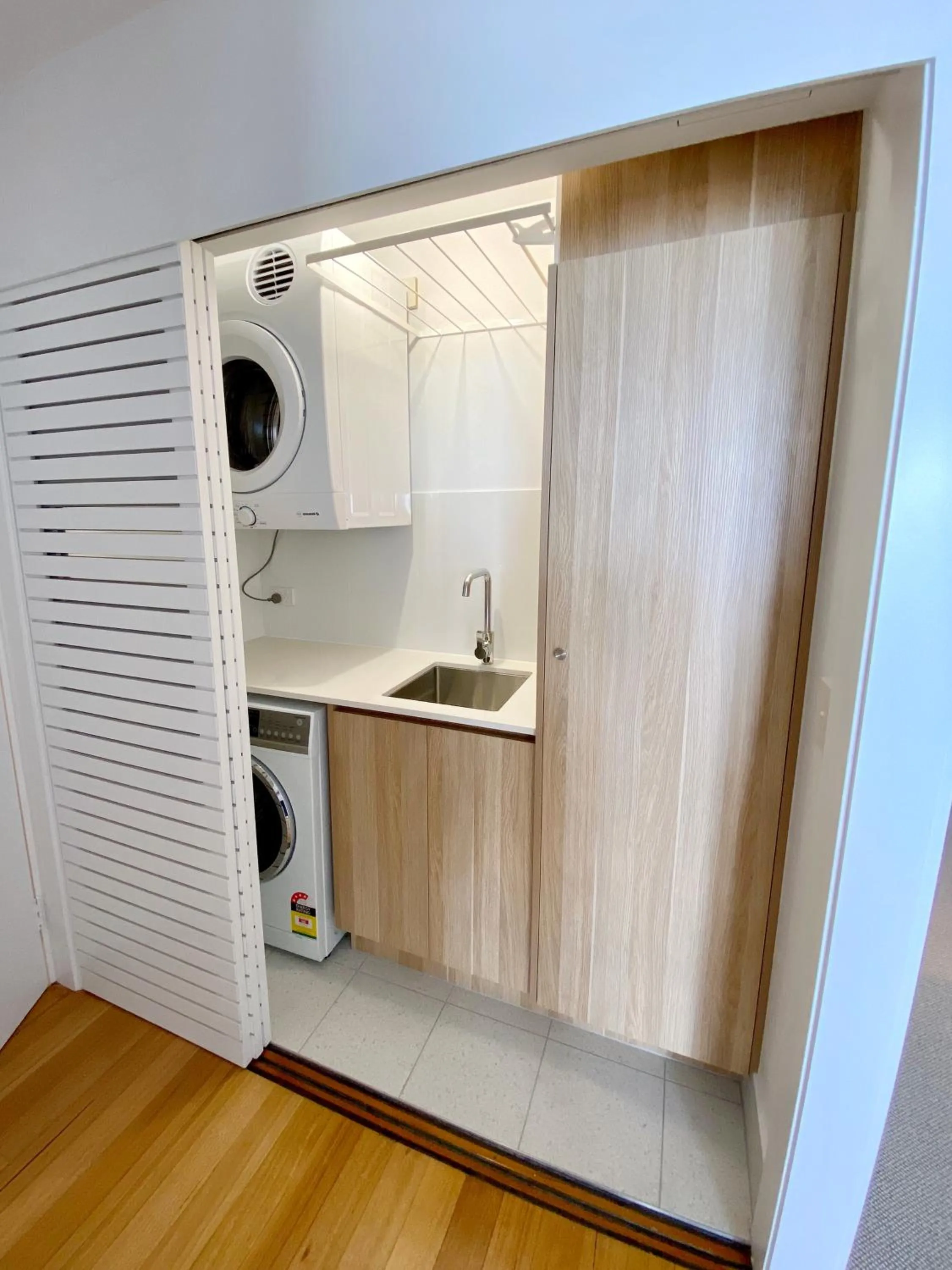 laundry in 84 The Spit Holiday Apartments