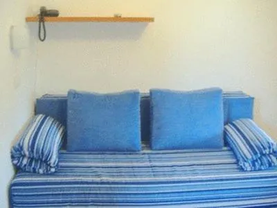 Seating area, Bed in Santa Maria villaggio turistico