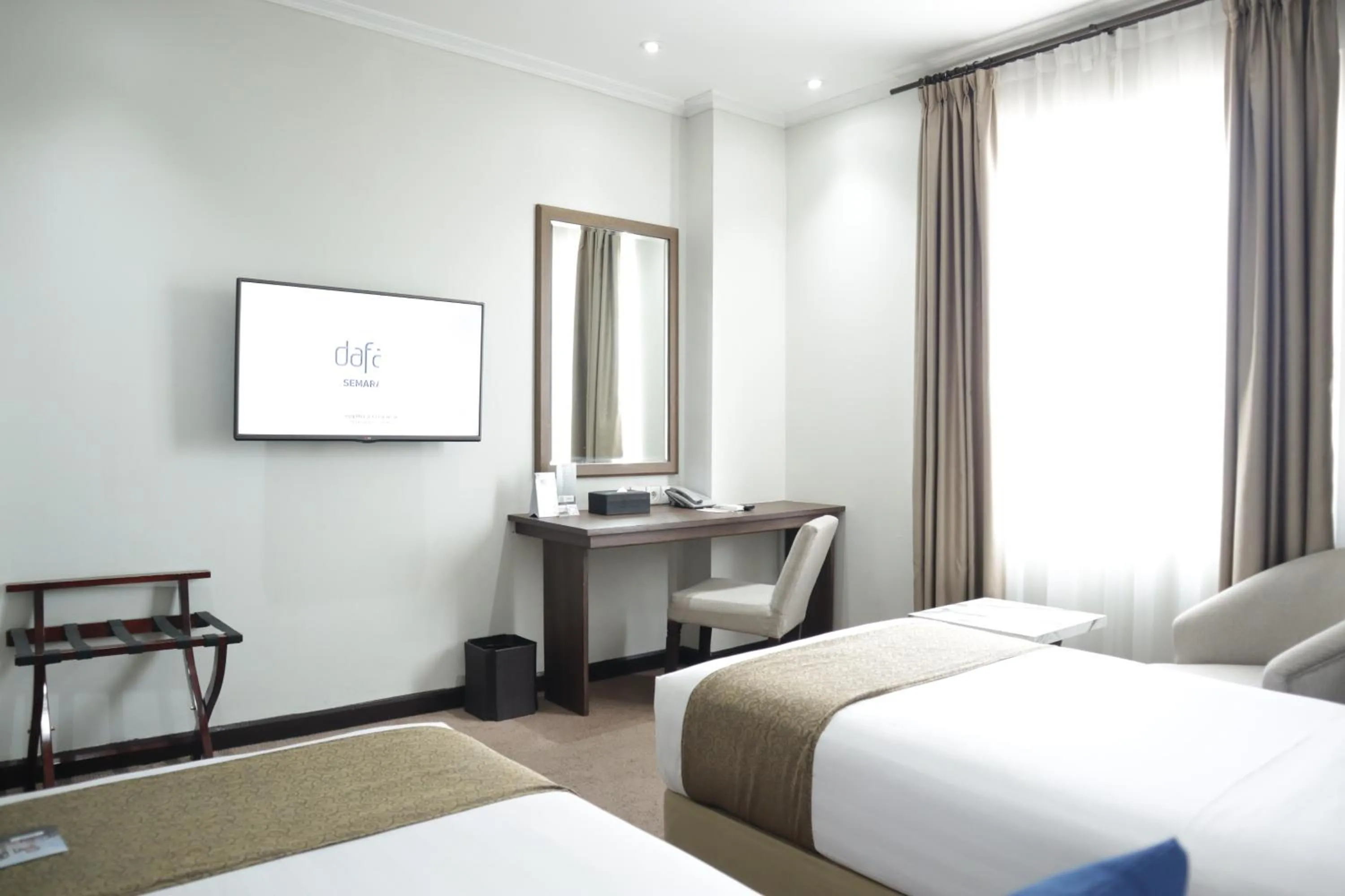 Bed in Hotel Dafam Semarang