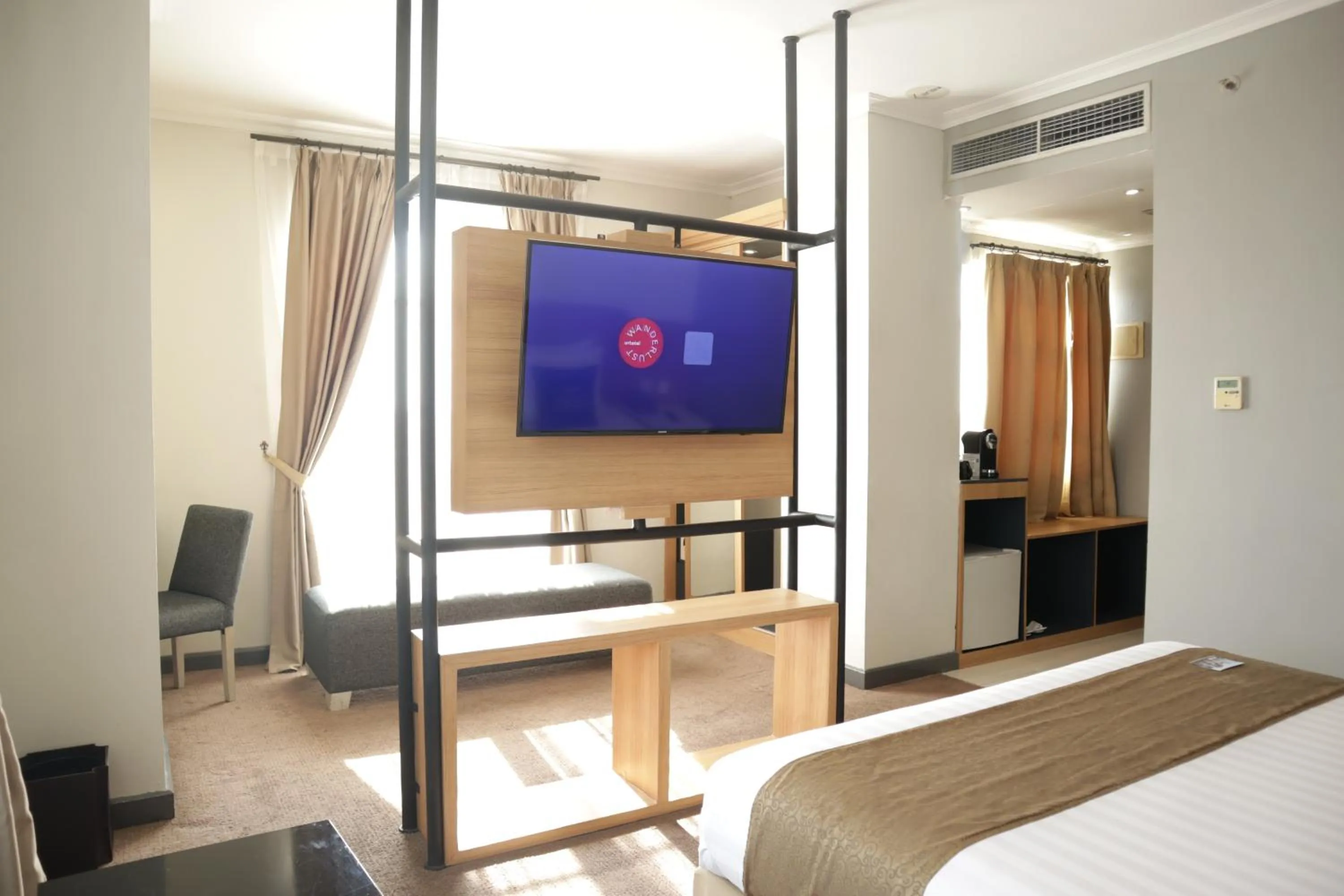 Bed in Hotel Dafam Semarang