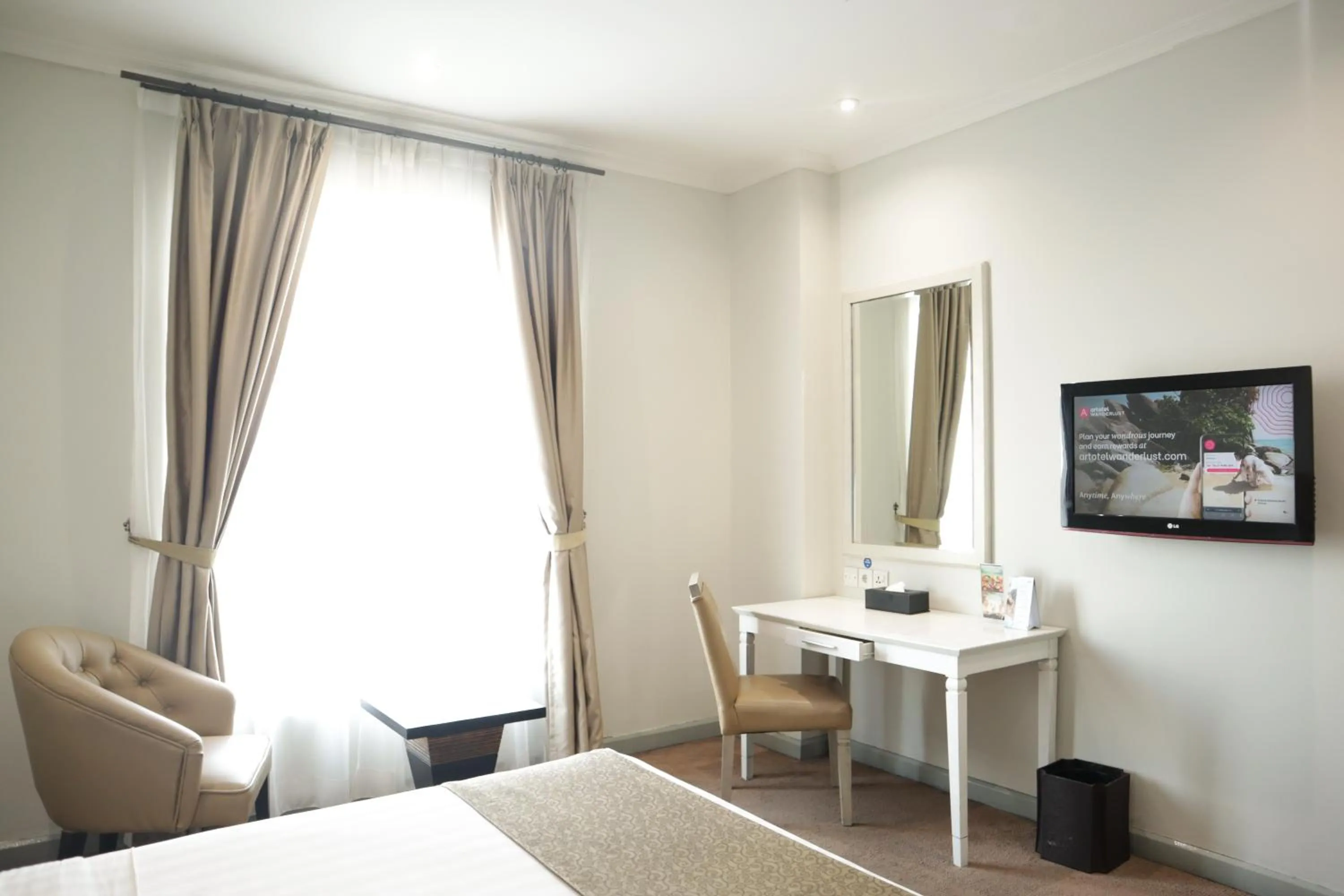 Bed in Hotel Dafam Semarang