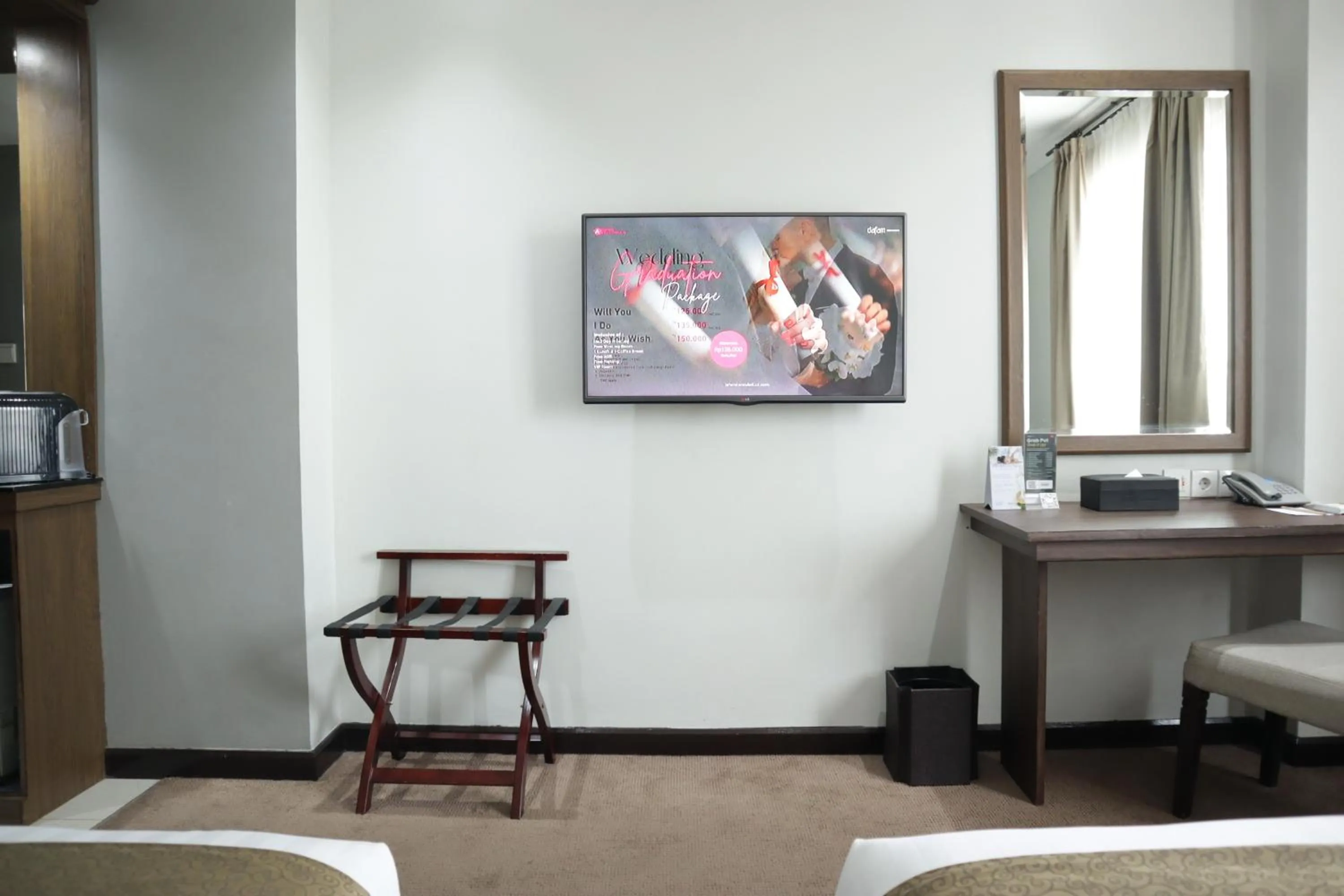 Bed in Hotel Dafam Semarang