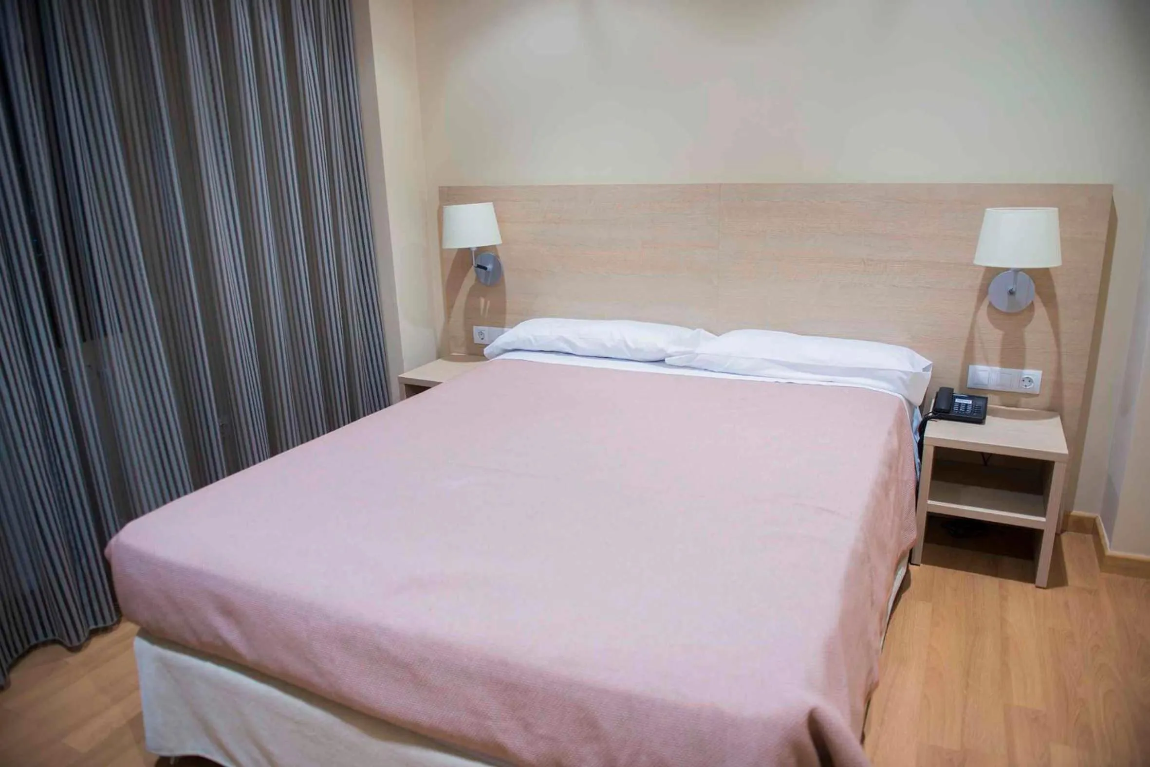 Bed in Hotel Meson de Erosa