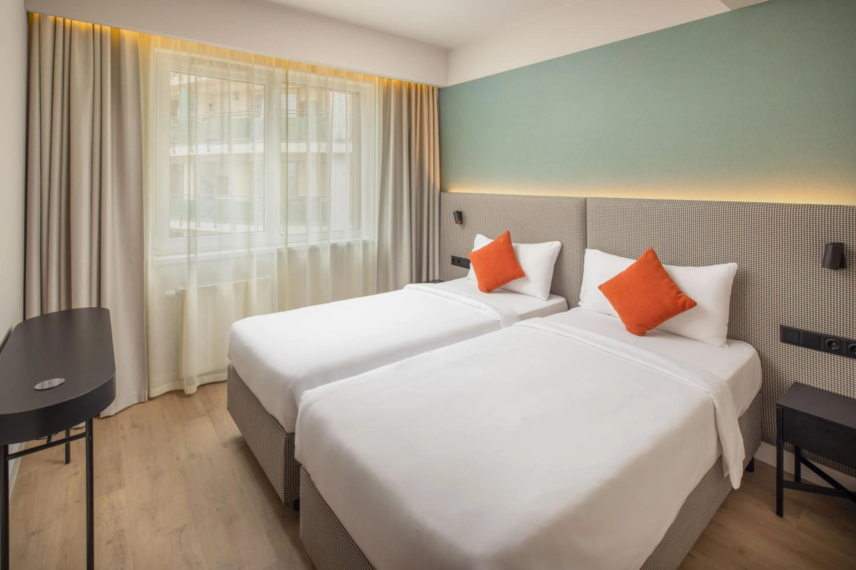 Bed in Escala Hotel & Suites