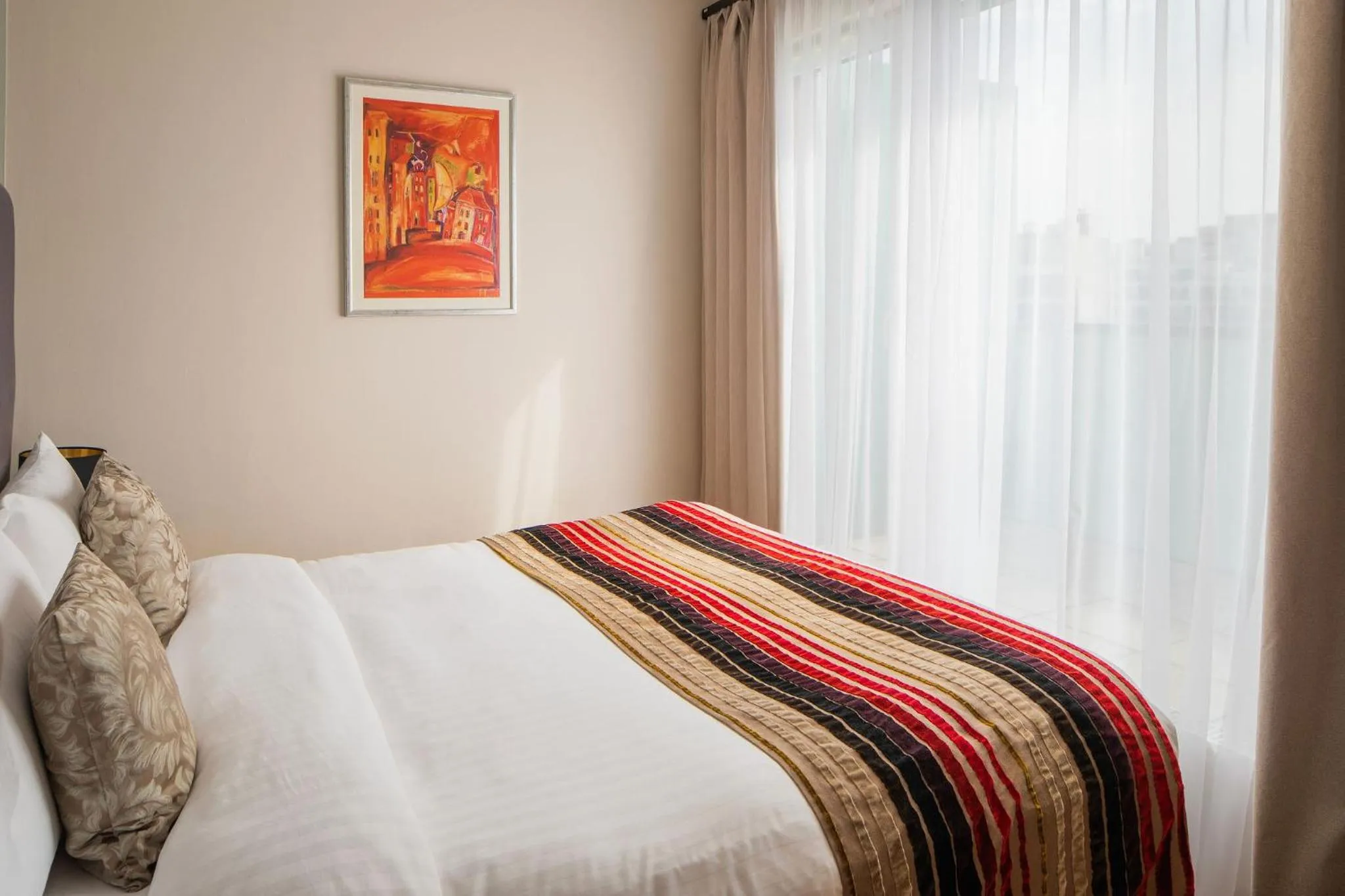 Bed in Escala Hotel & Suites