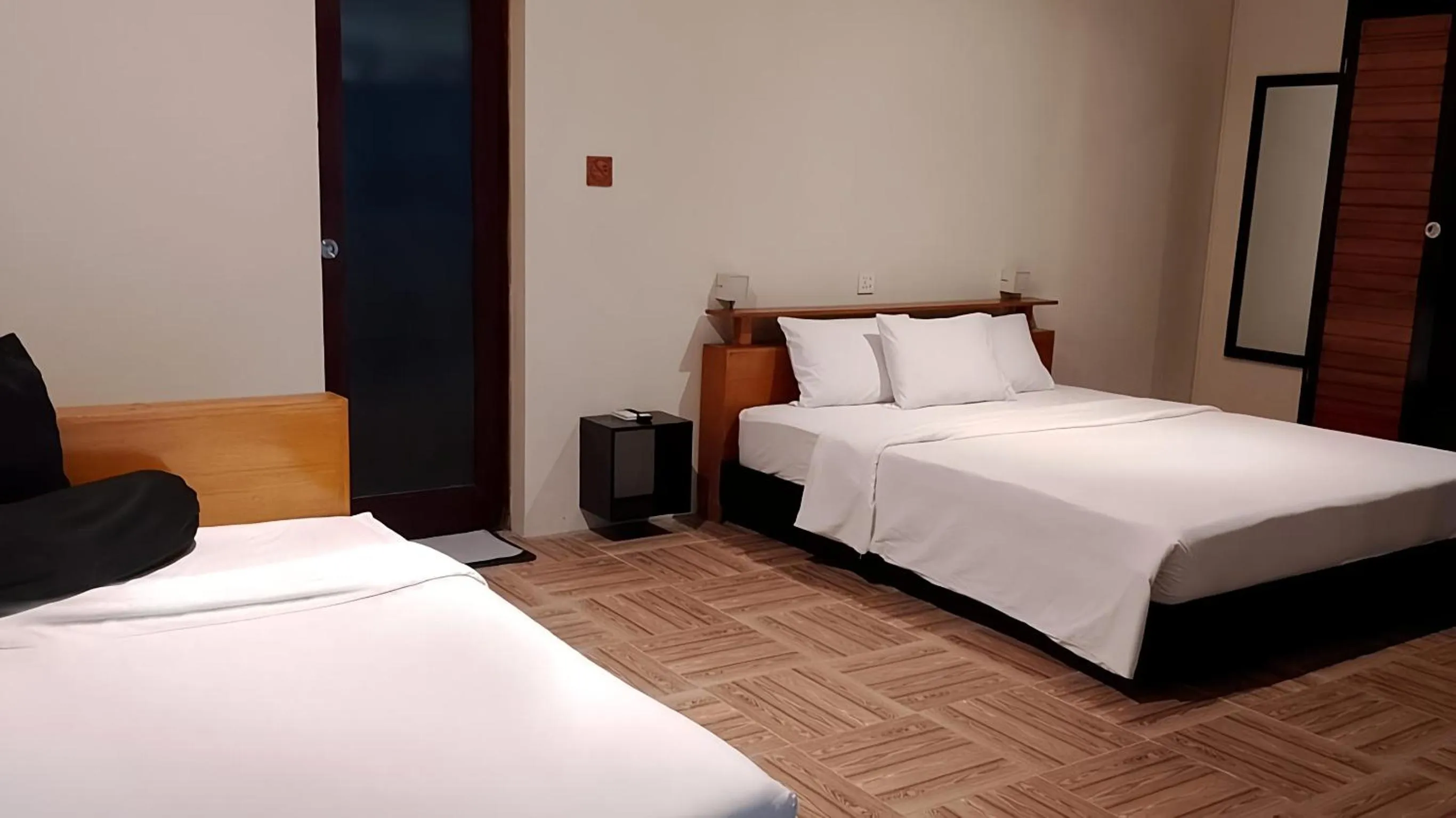 Bed in JavaCove Beach Hotel