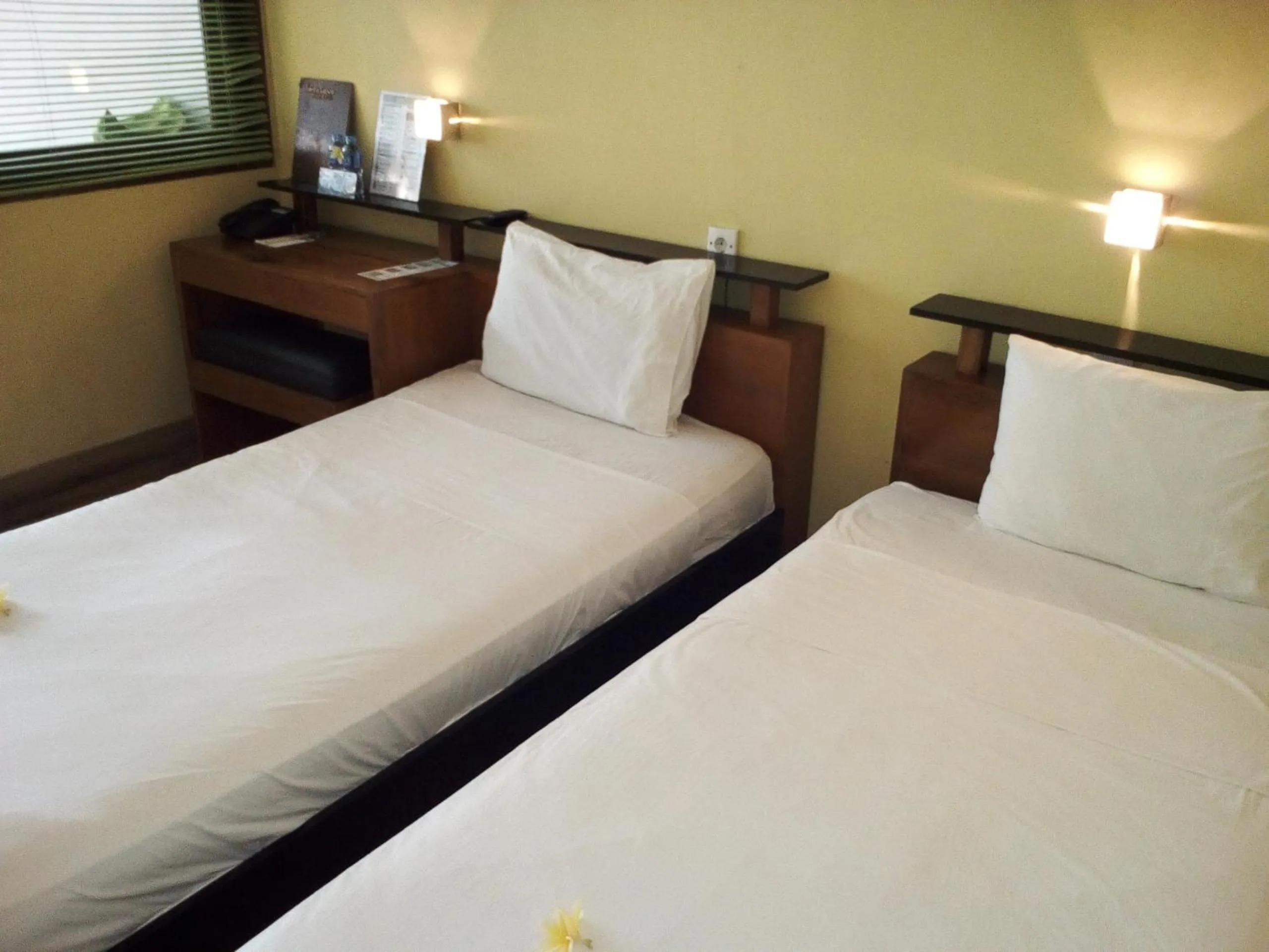 Bed in JavaCove Beach Hotel