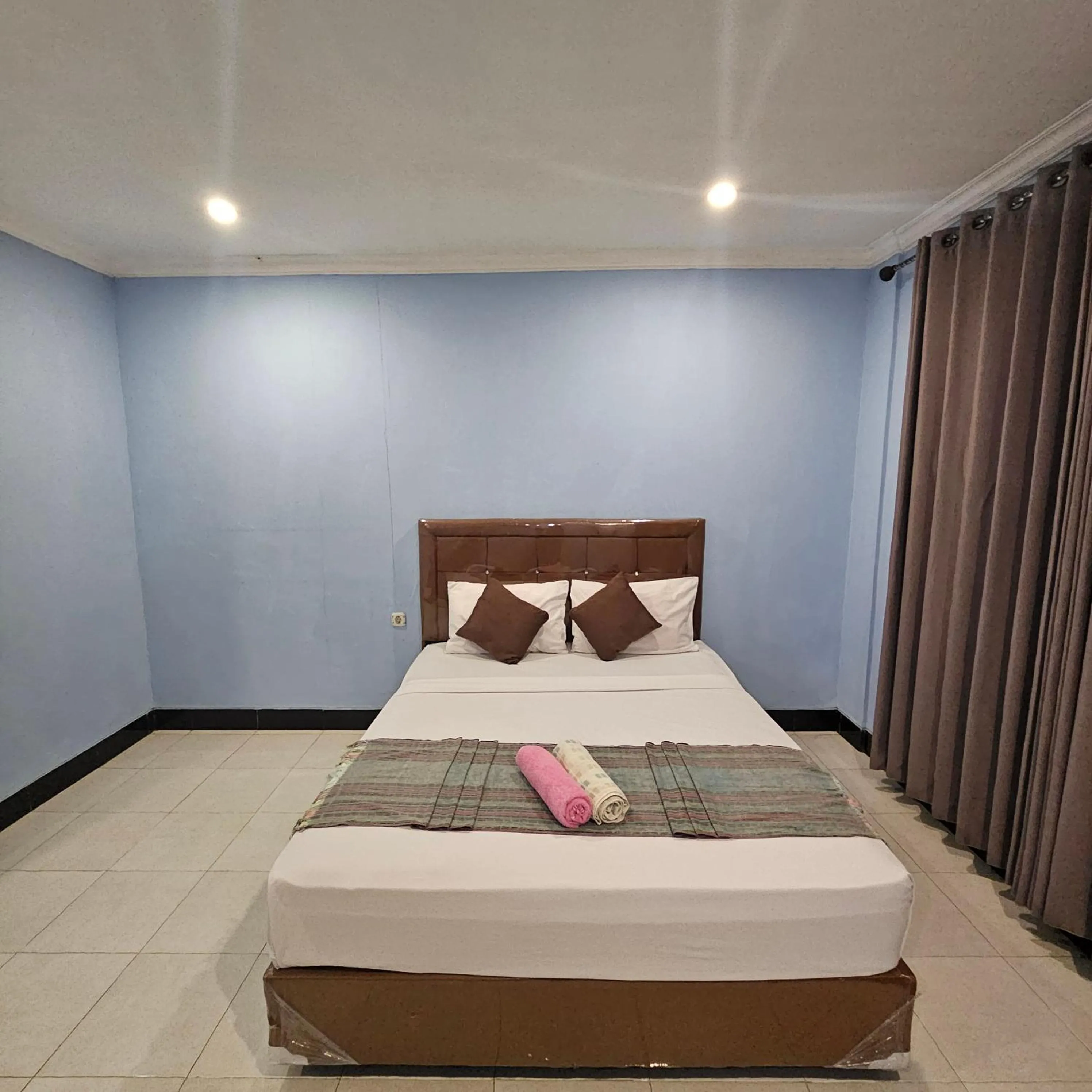 Bed in Ridho Malik Hotel