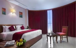 Bed in Al Madina Suites Doha