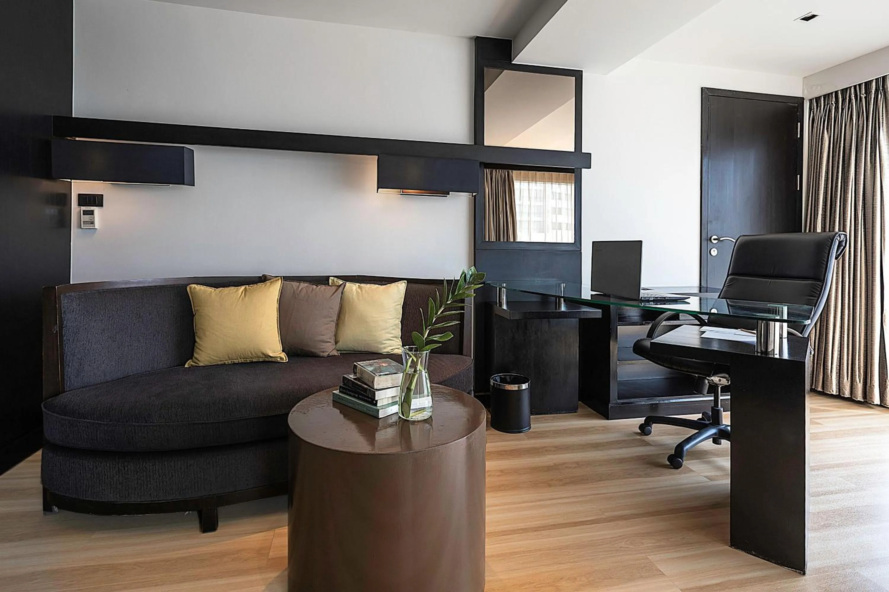 Seating area in Golden Tulip Mandison Suites