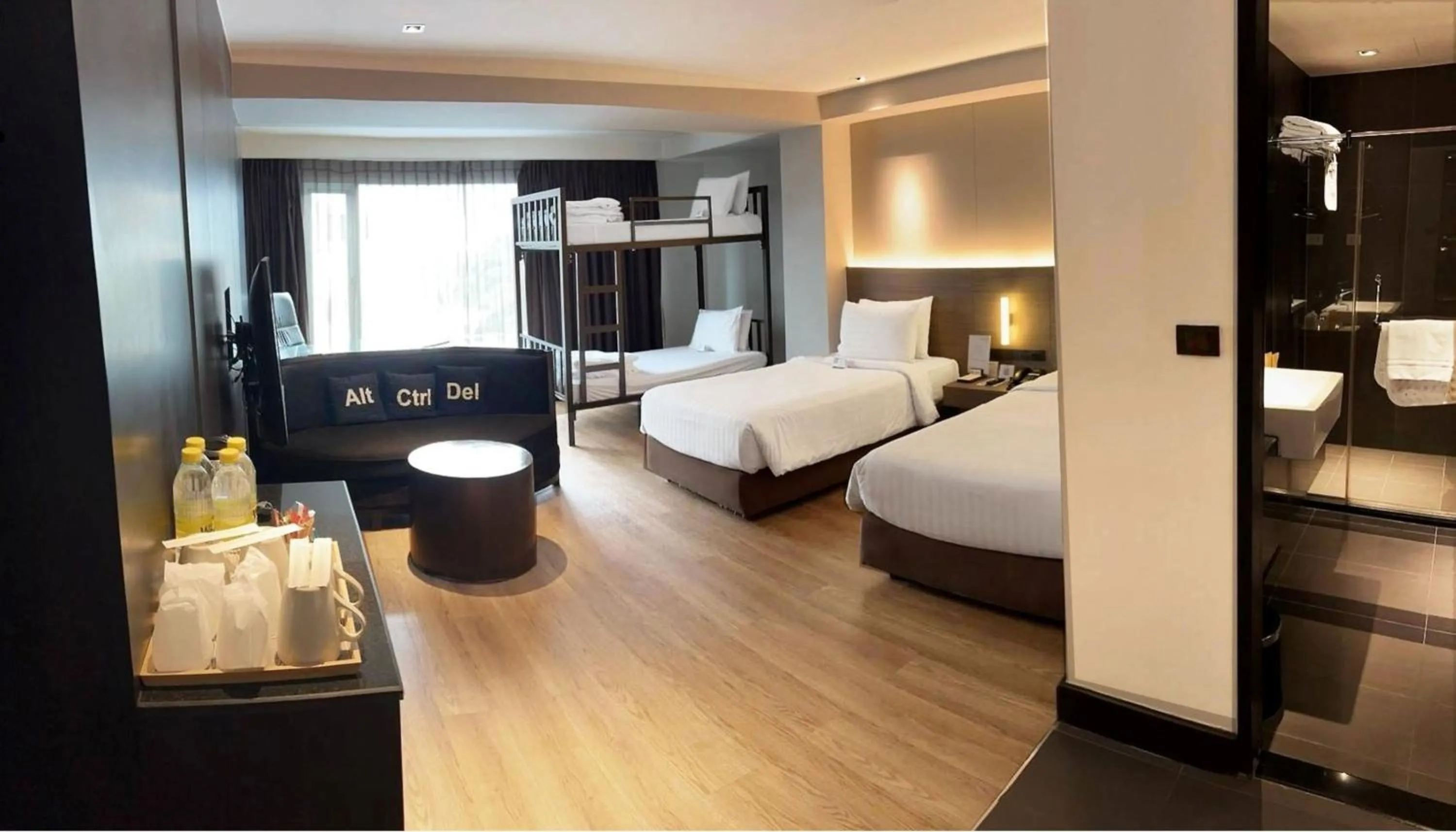 Bed in Golden Tulip Mandison Suites