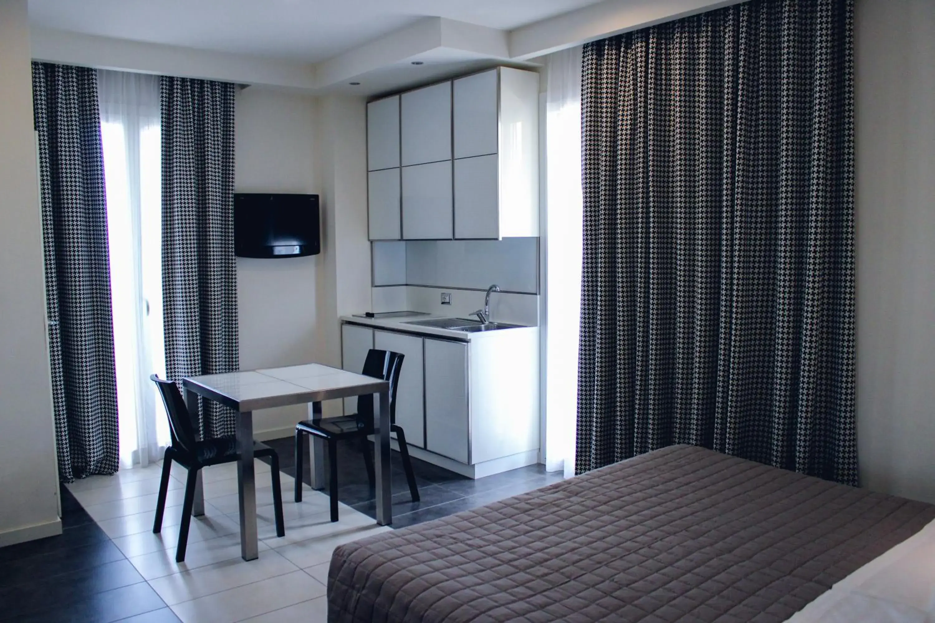 TV and multimedia, Bed in Atmosphere Suite Hotel
