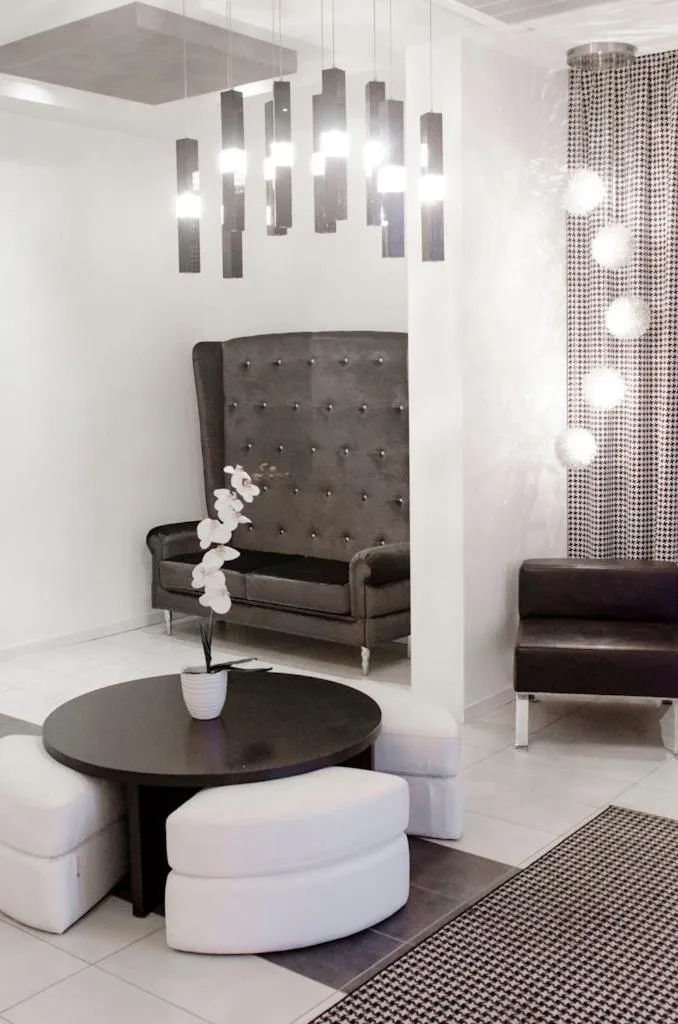 Communal lounge/ TV room in Atmosphere Suite Hotel