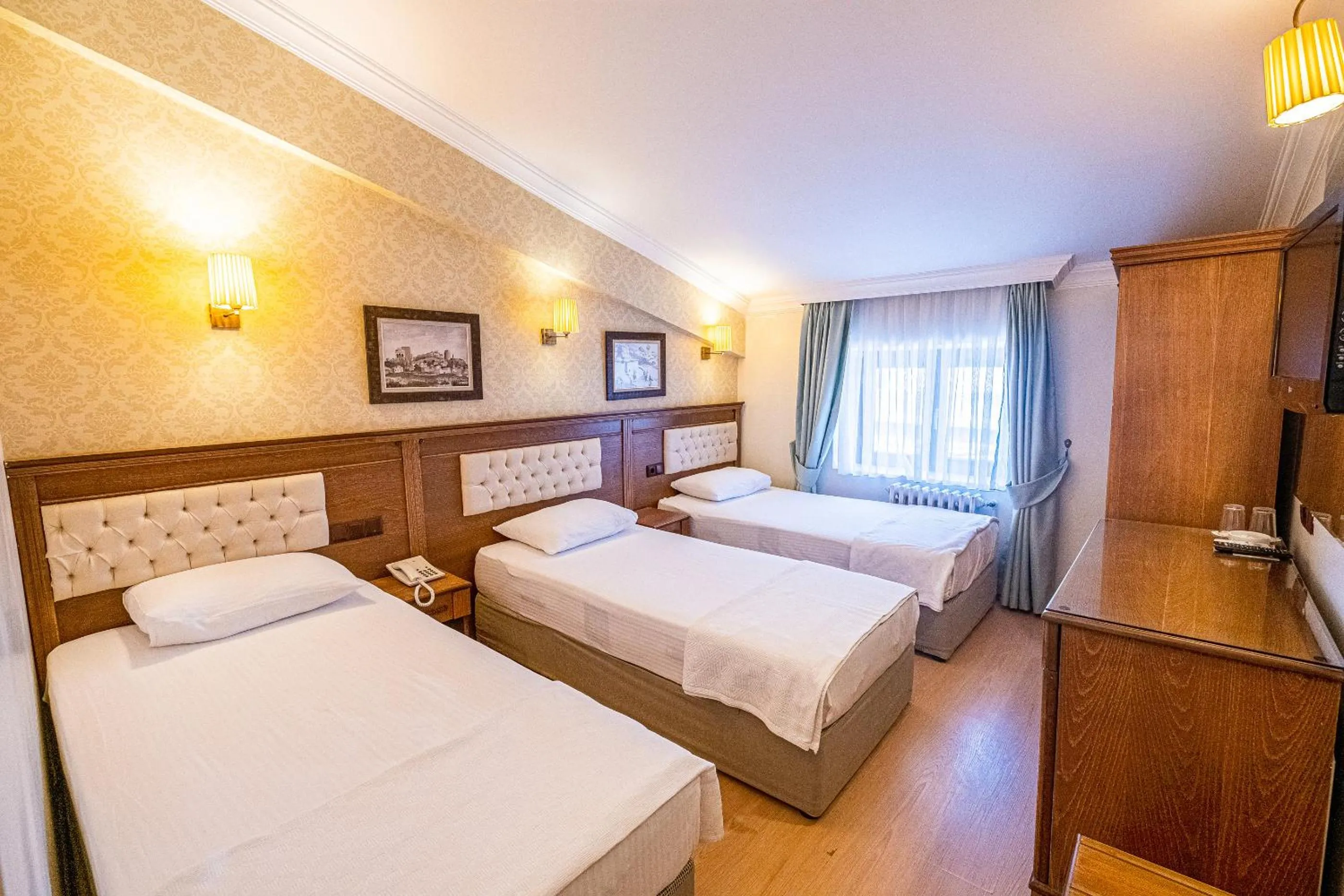 Photo of the whole room, Bed in Assos Kervansaray Hotel - Special Category