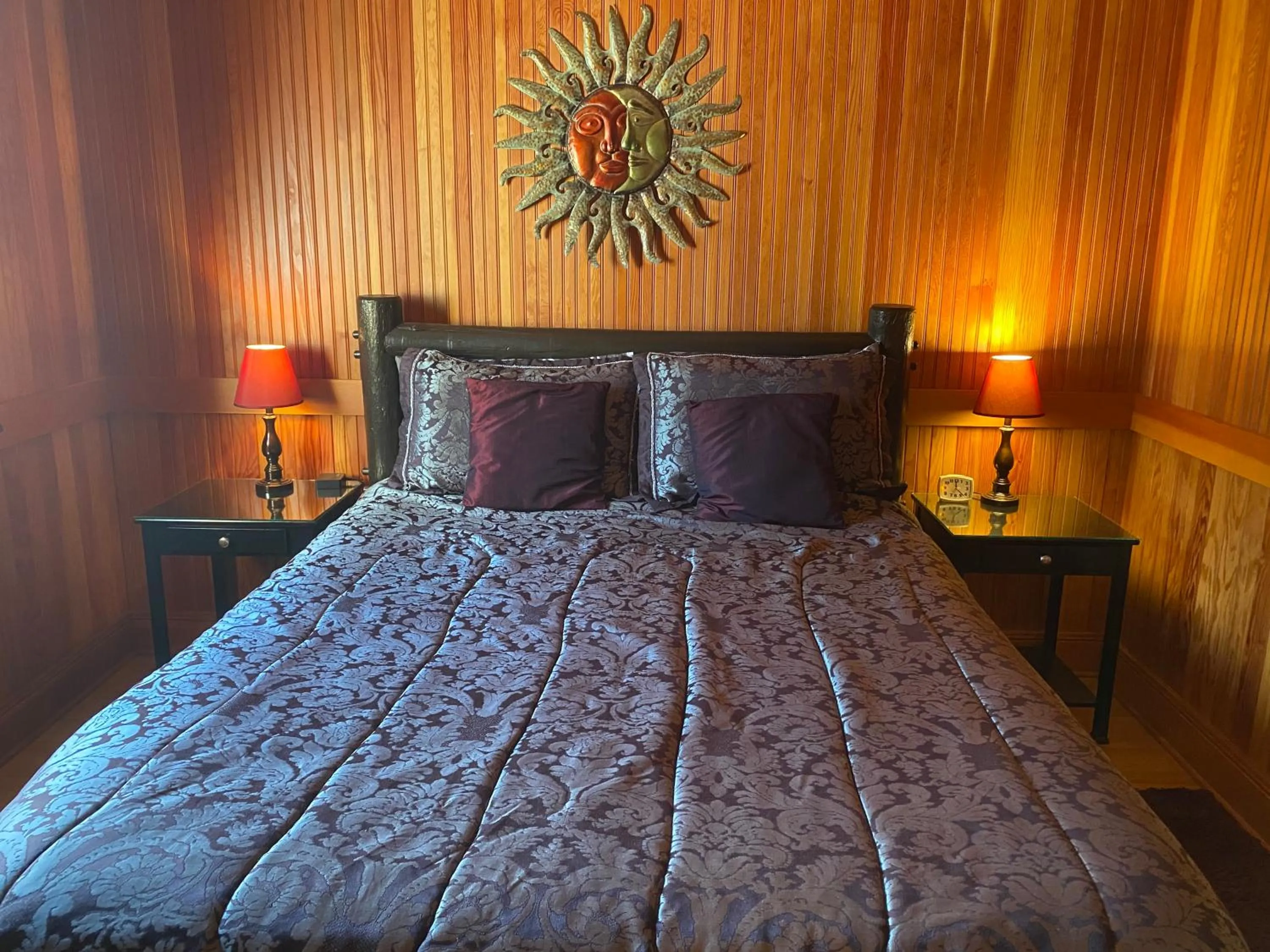 Bed in Whistling Winds Motel