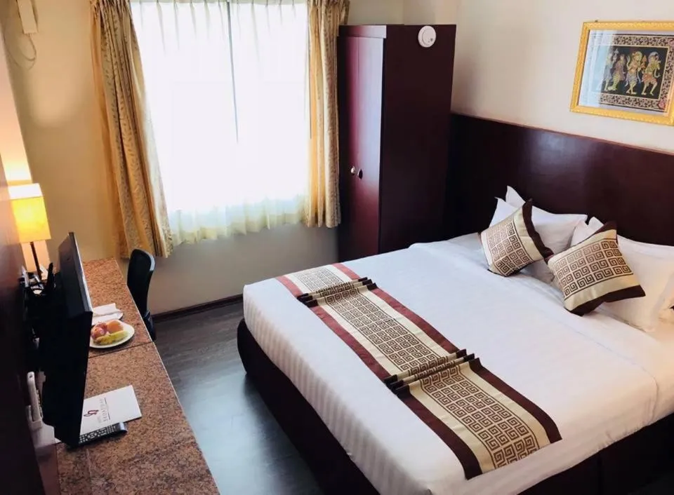 Bed in Hotel Broadway Yangon