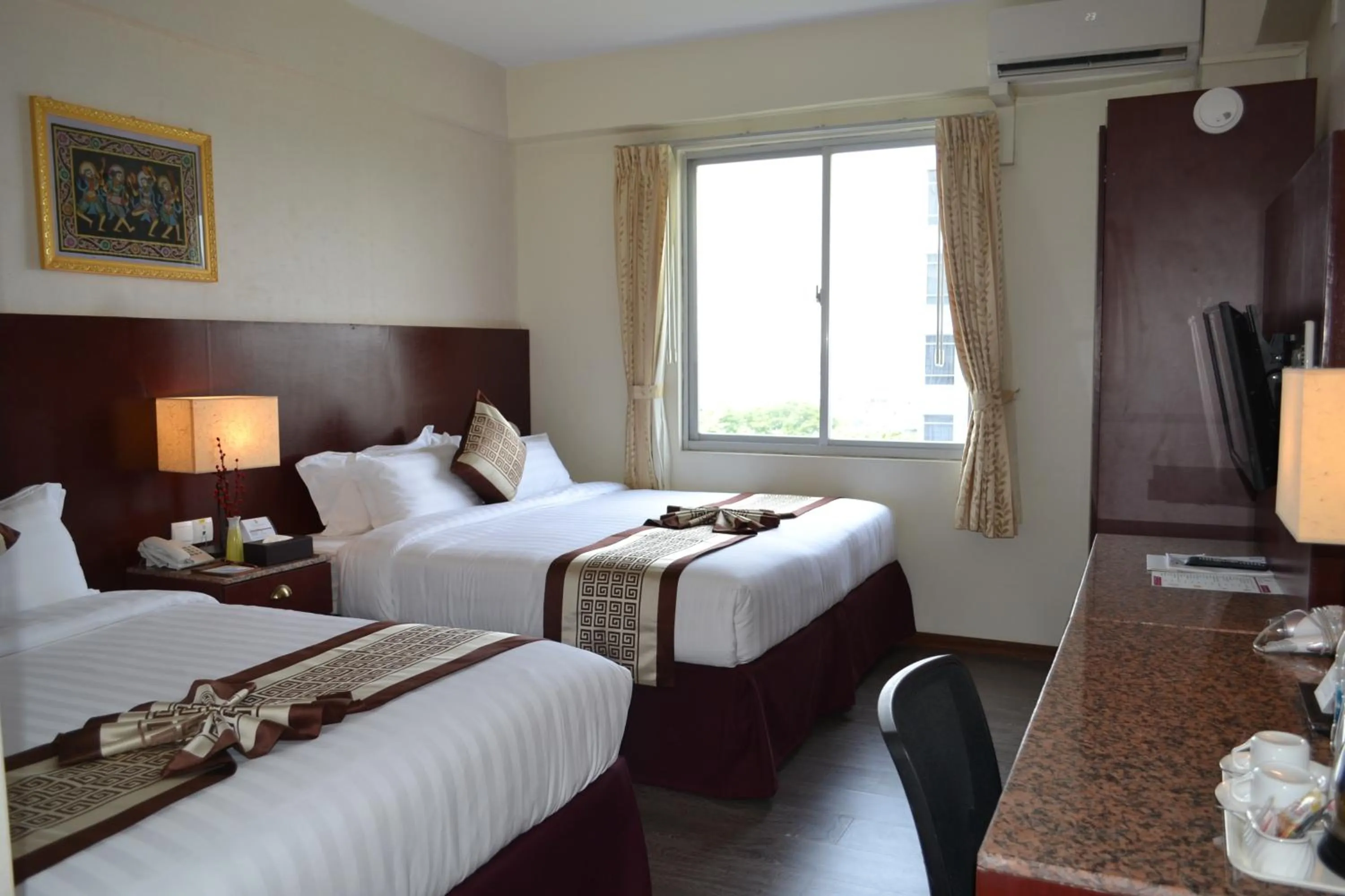 Bed in Hotel Broadway Yangon