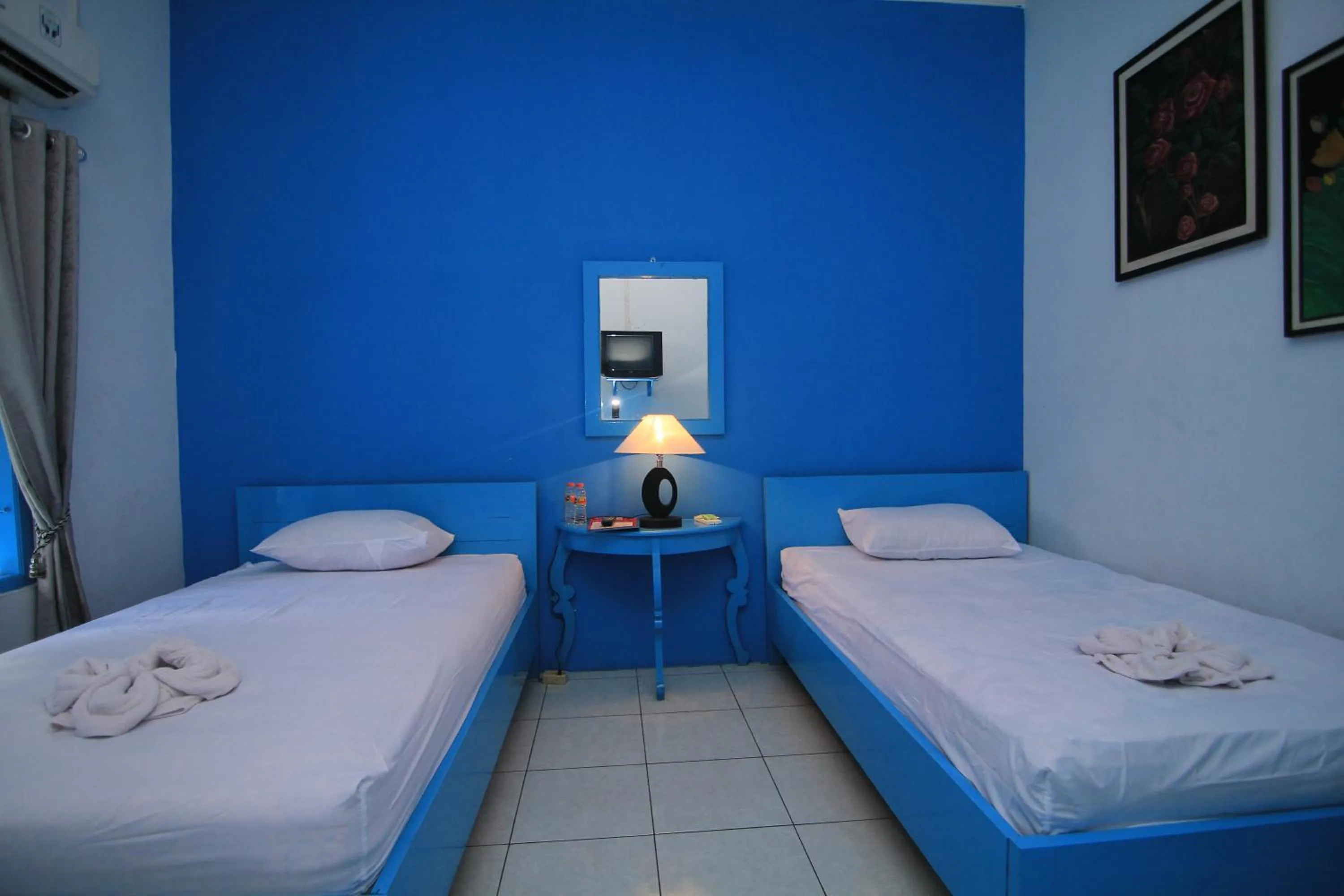 Bed in Hotel Boegenviel Syariah