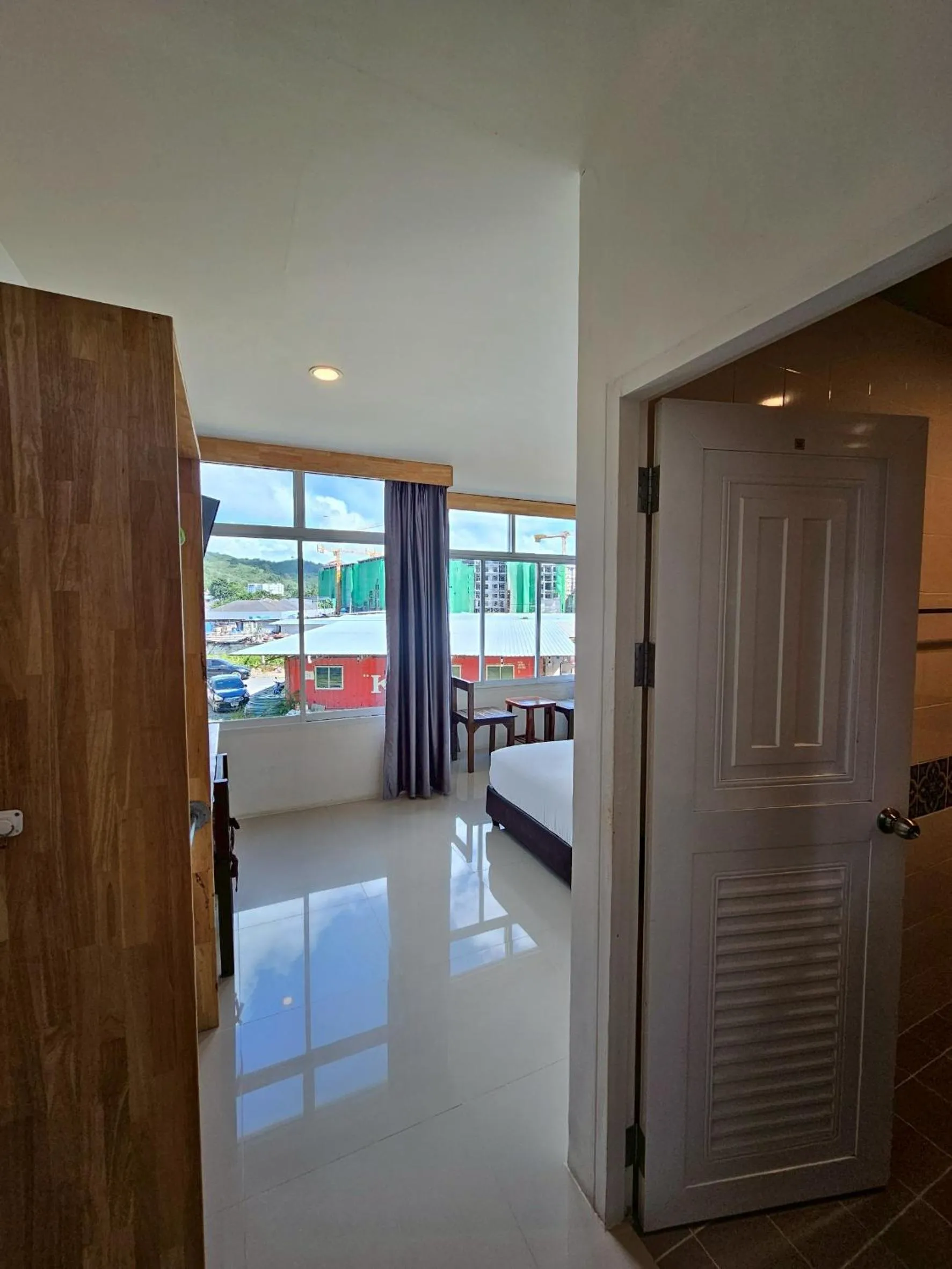 Bed in Dwell Phuket Airport Hotel at Naiyang