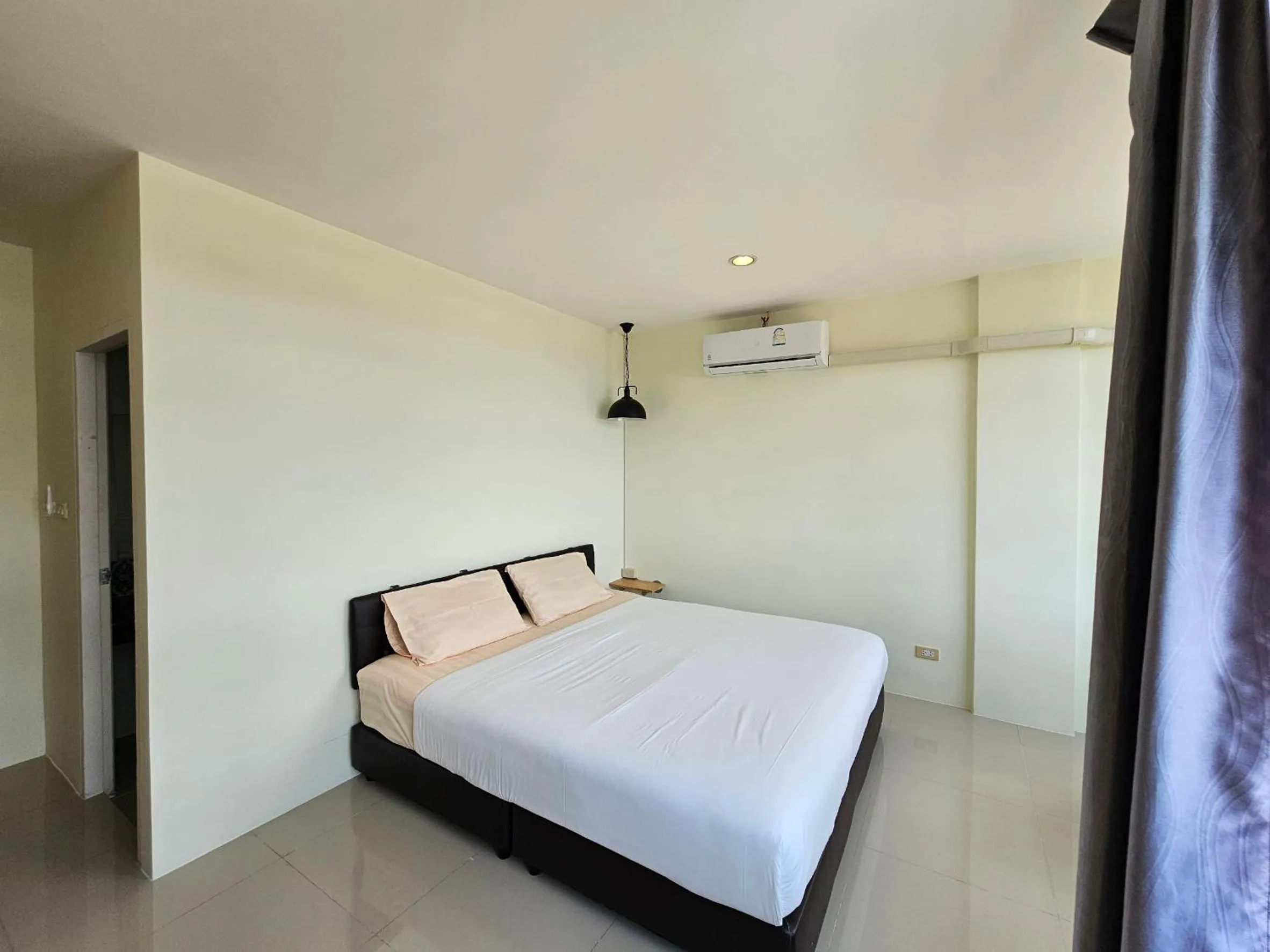 Photo of the whole room, Bed in Dwell Phuket Airport Hotel at Naiyang