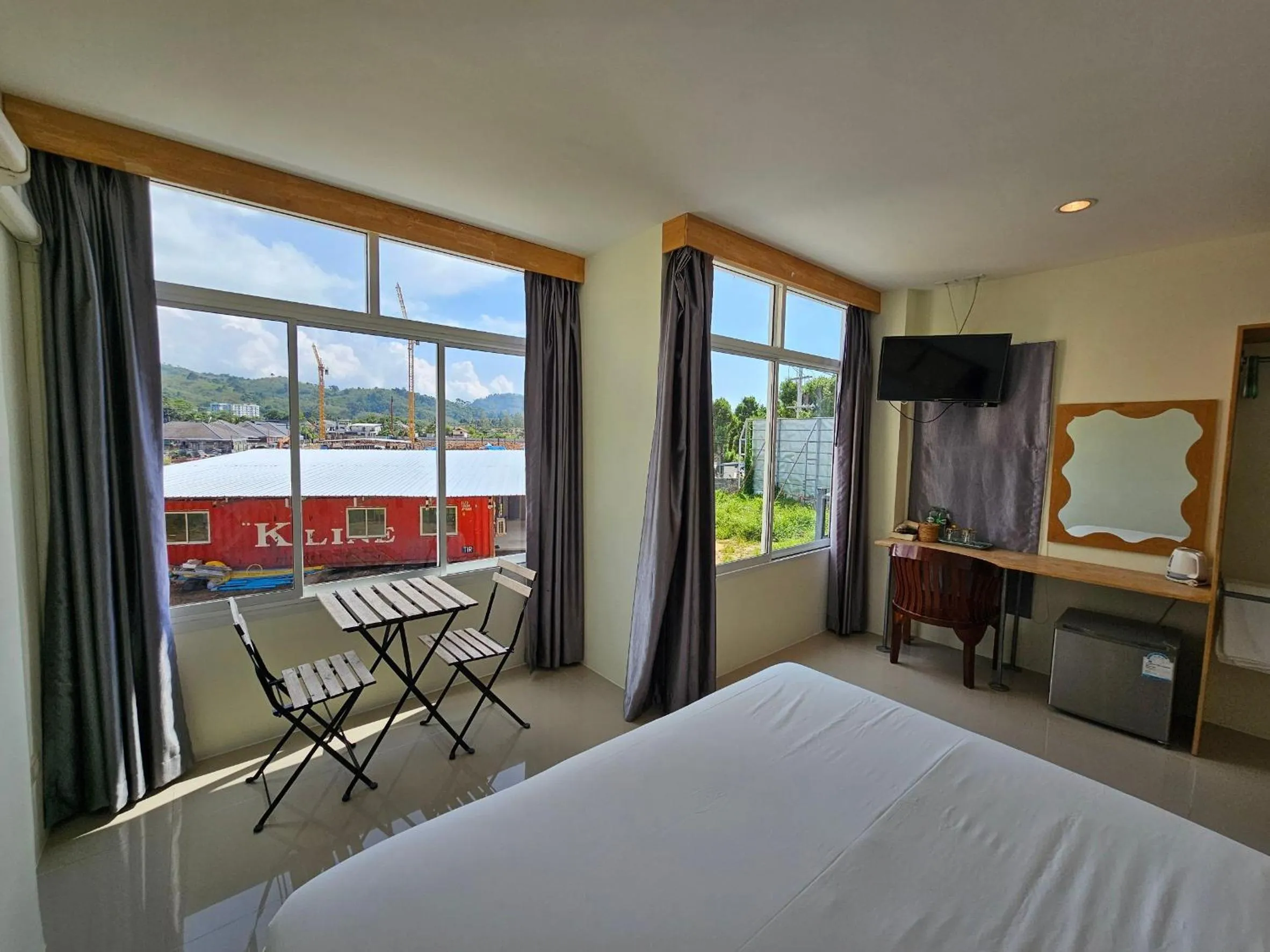 Bed in Dwell Phuket Airport Hotel at Naiyang