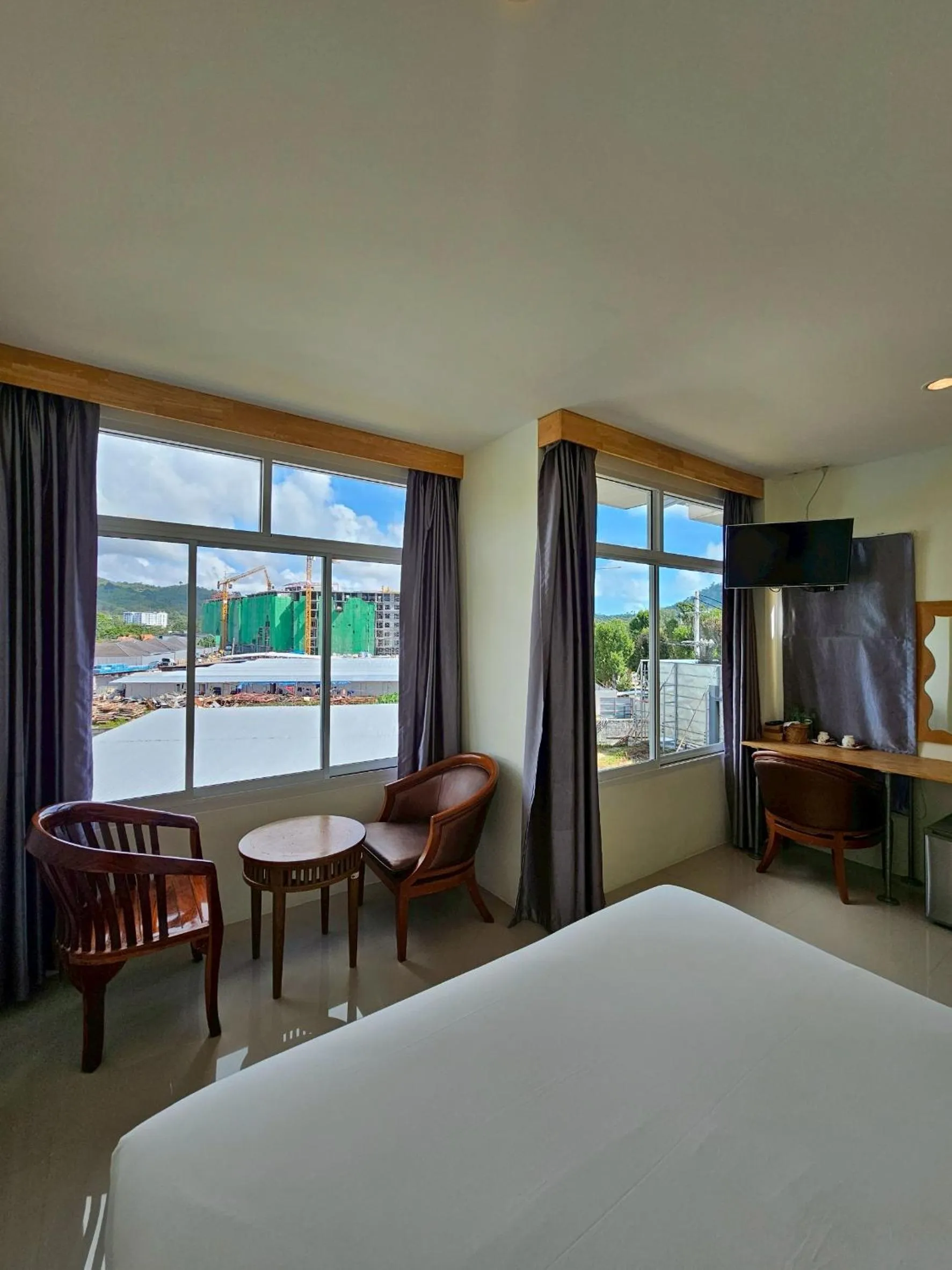 Bed in Dwell Phuket Airport Hotel at Naiyang