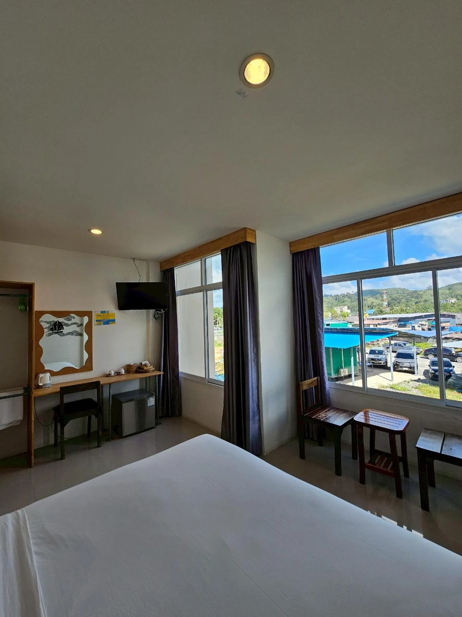 Bed in Dwell Phuket Airport Hotel at Naiyang