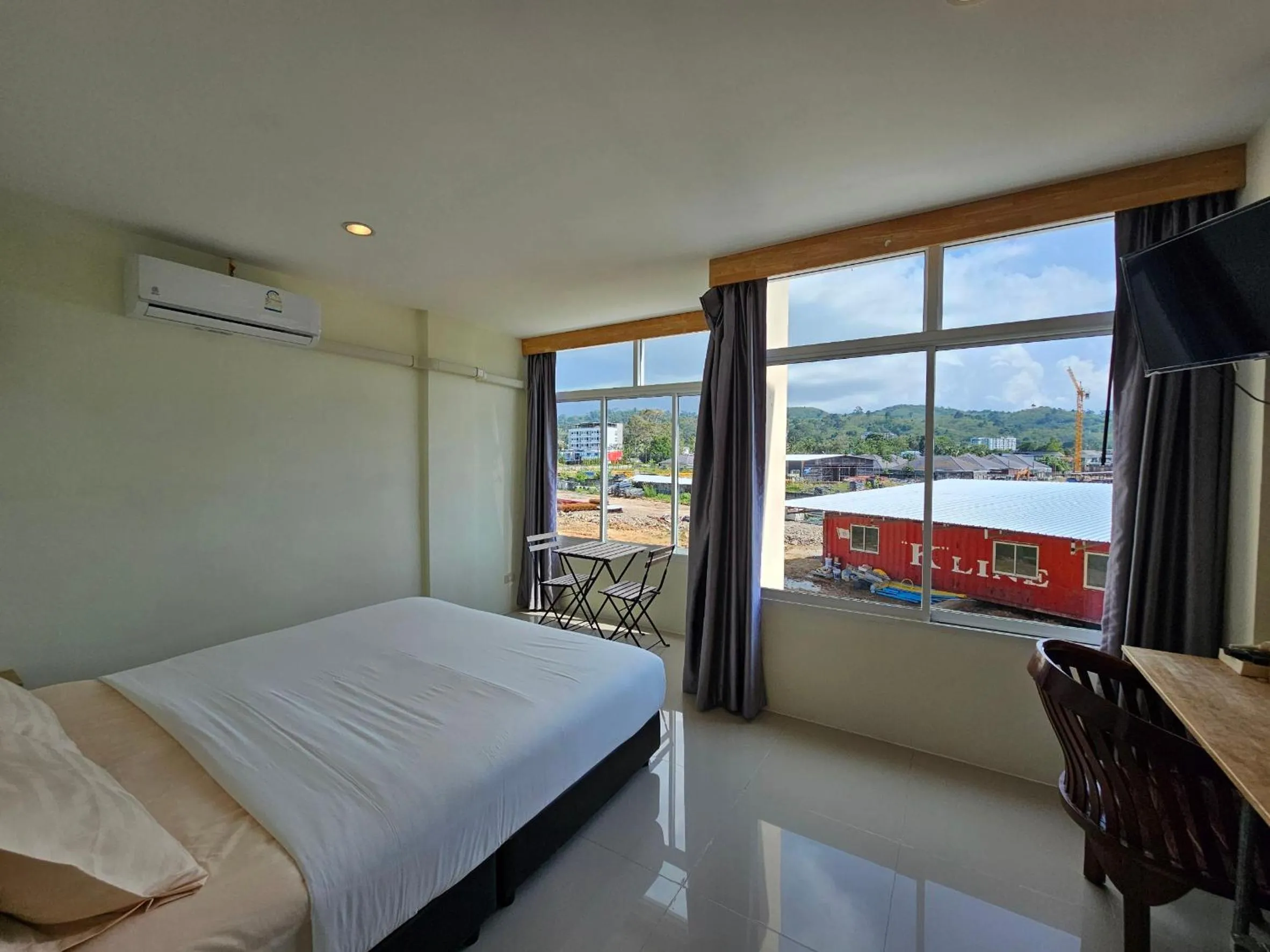 Bed in Dwell Phuket Airport Hotel at Naiyang