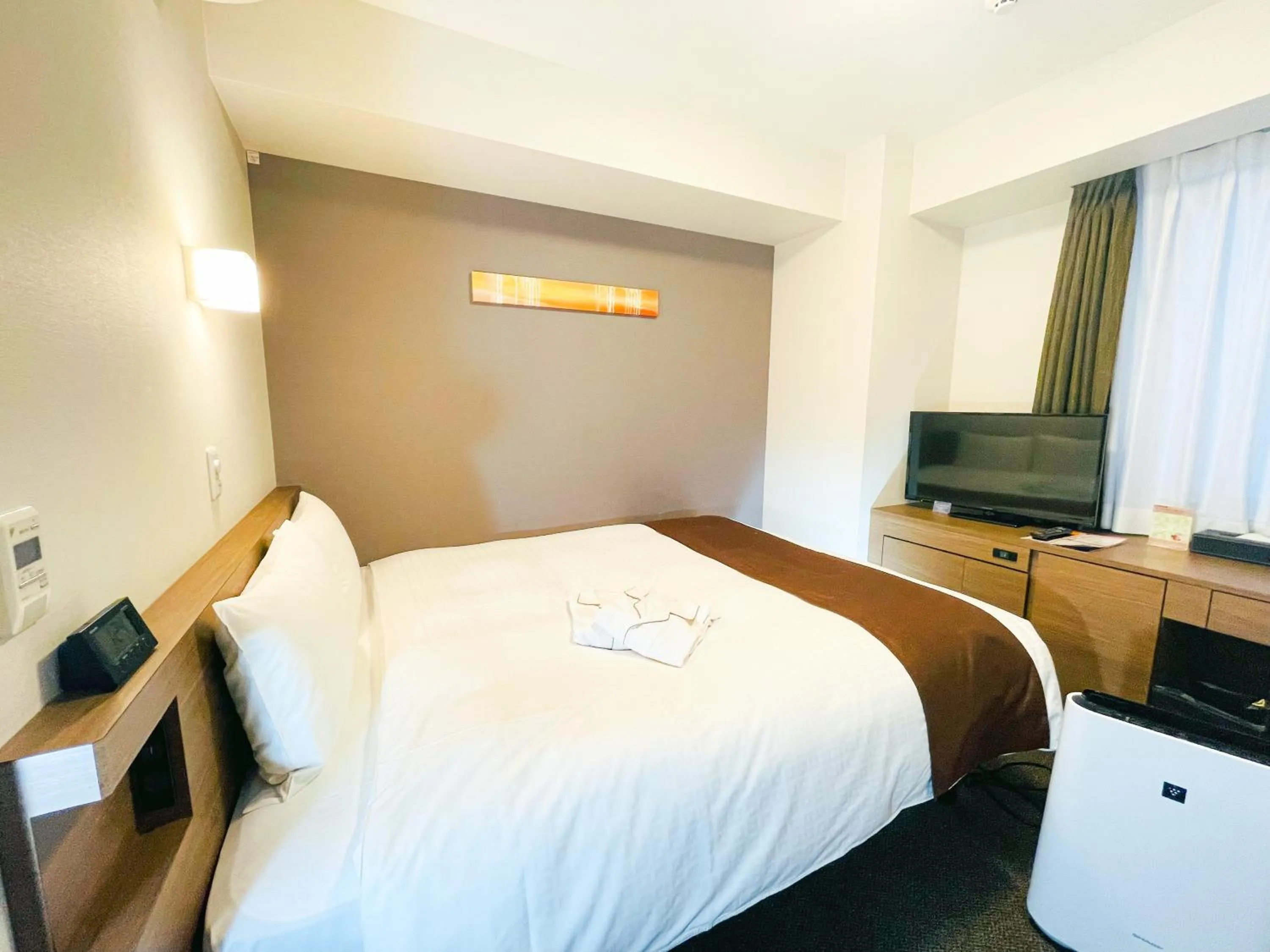 Bed in Smile Hotel Premium Sapporo Susukino