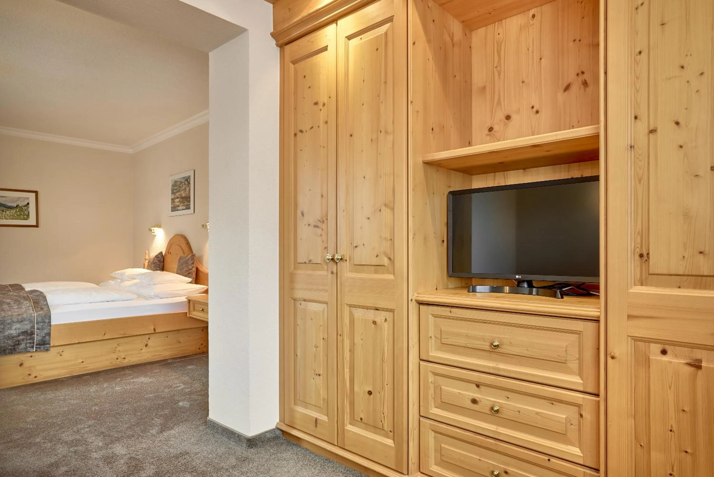 Bed in Hotel Appartement Roggal