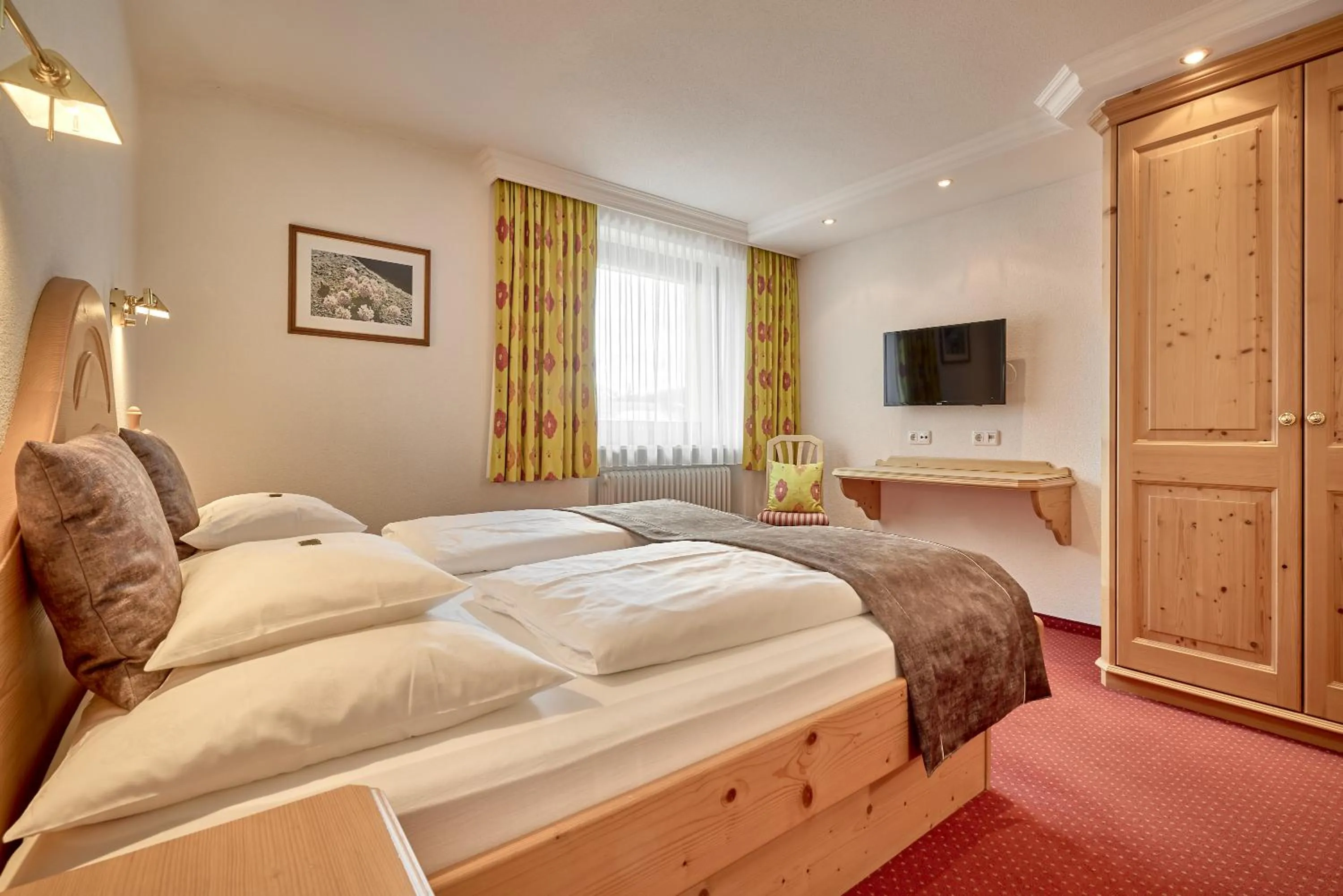 Bed in Hotel Appartement Roggal