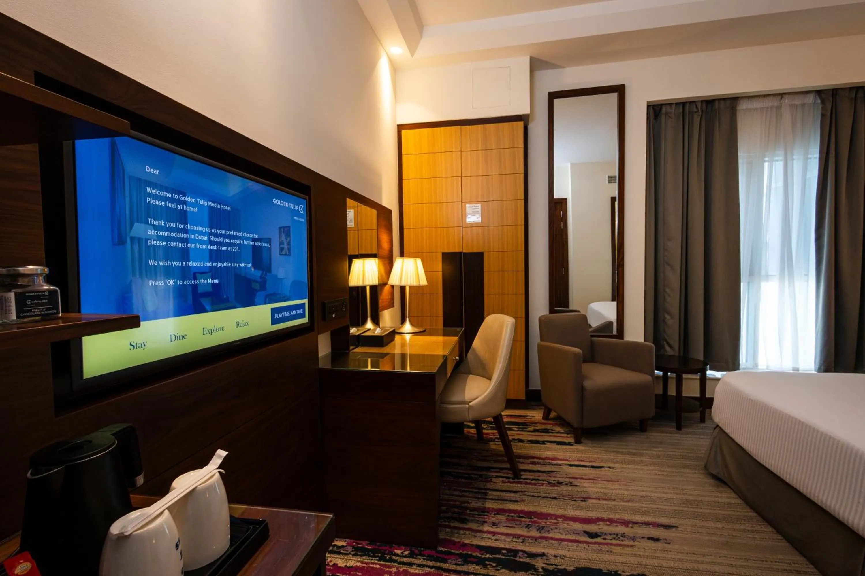 Bed in Golden Tulip Media Hotel