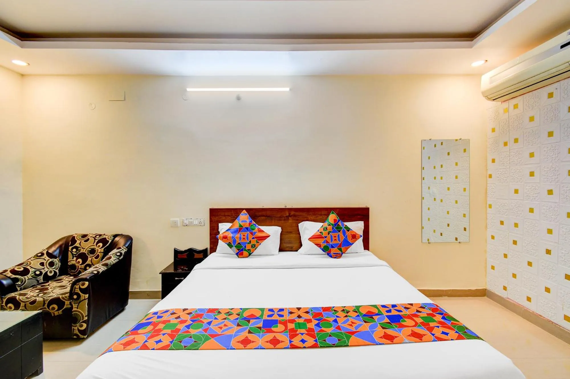 Bed in FabHotel Pushpa Grand