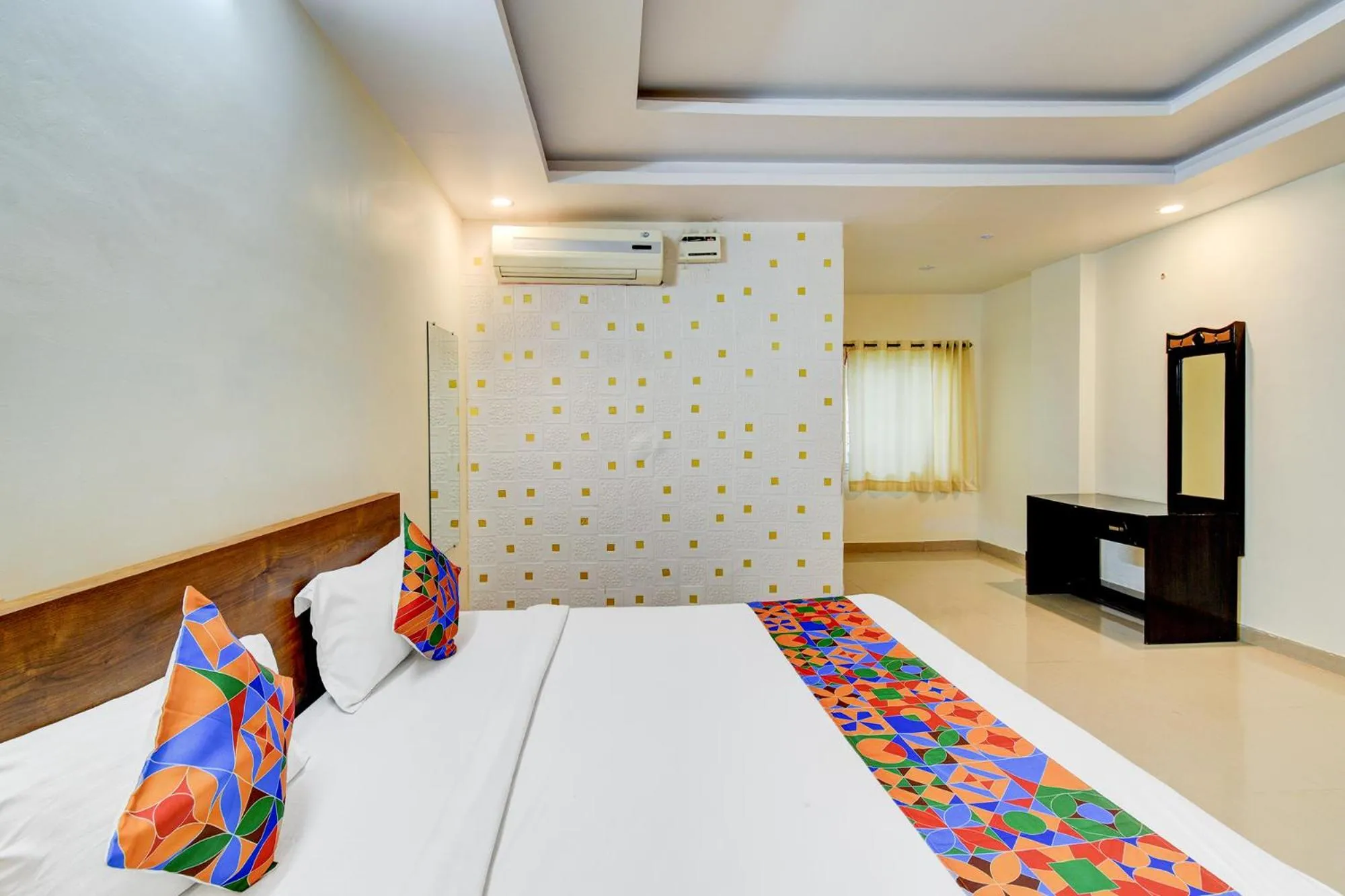 Bed in FabHotel Pushpa Grand