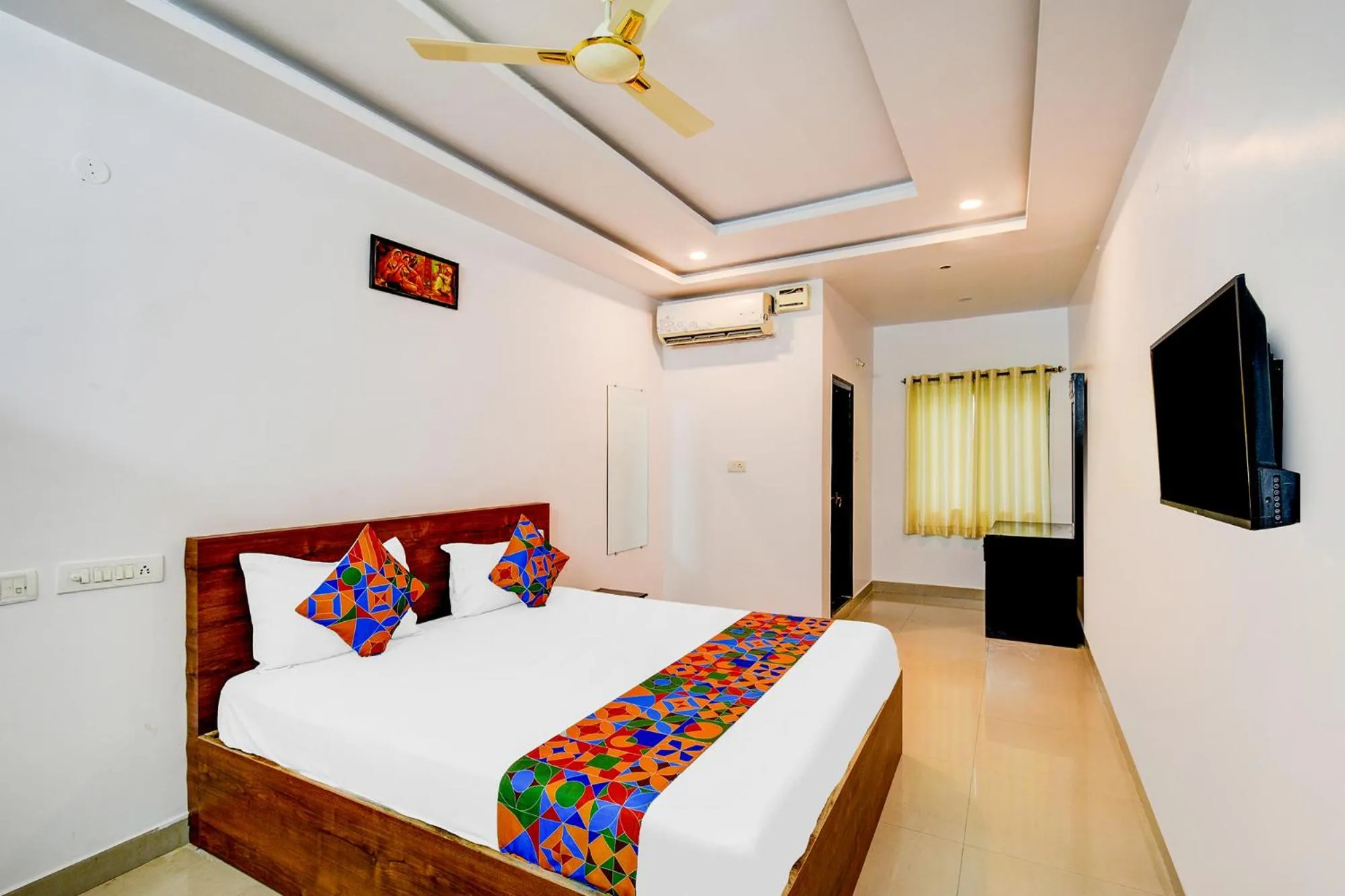 Bed in FabHotel Pushpa Grand