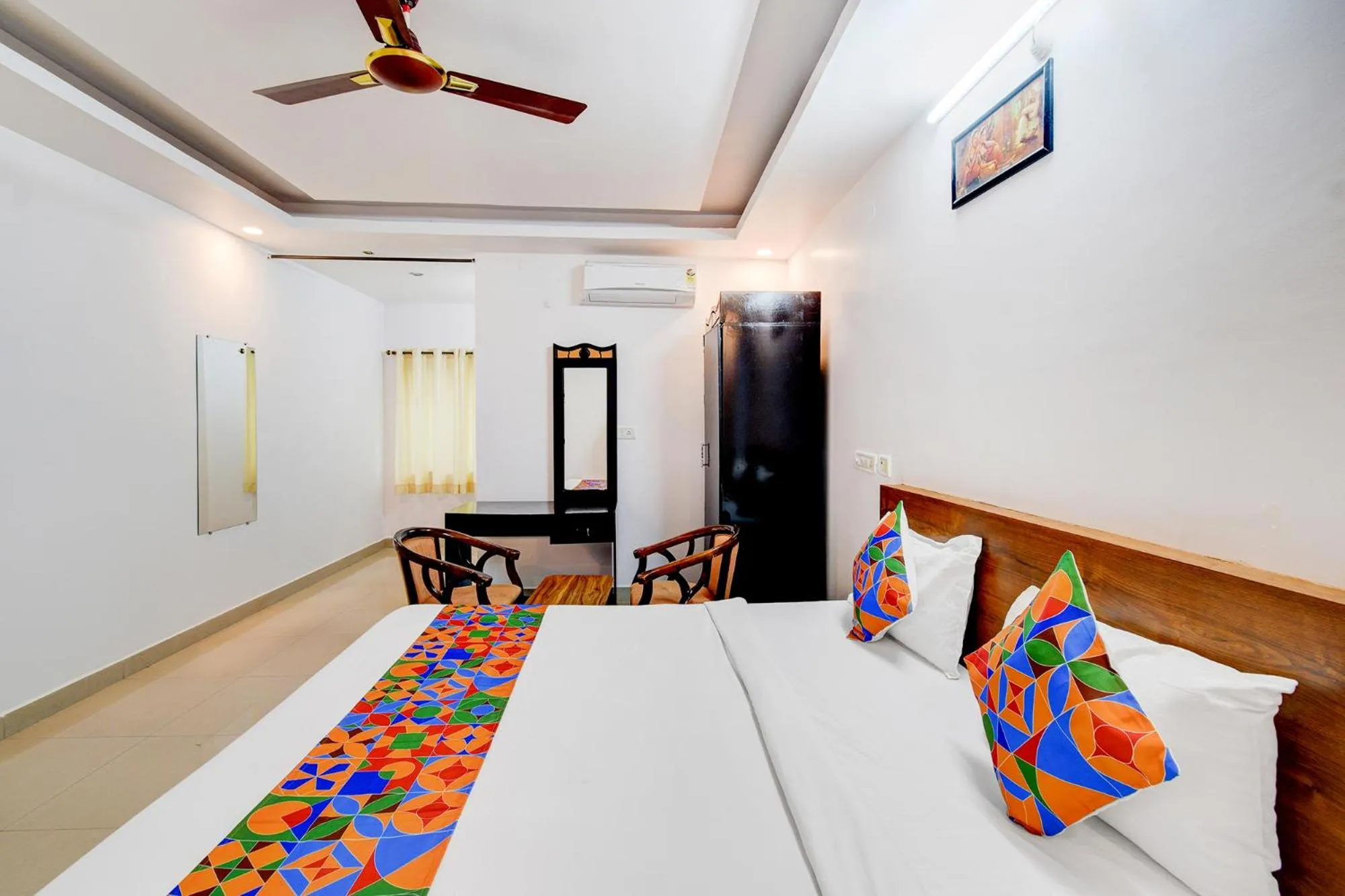 Bed in FabHotel Pushpa Grand