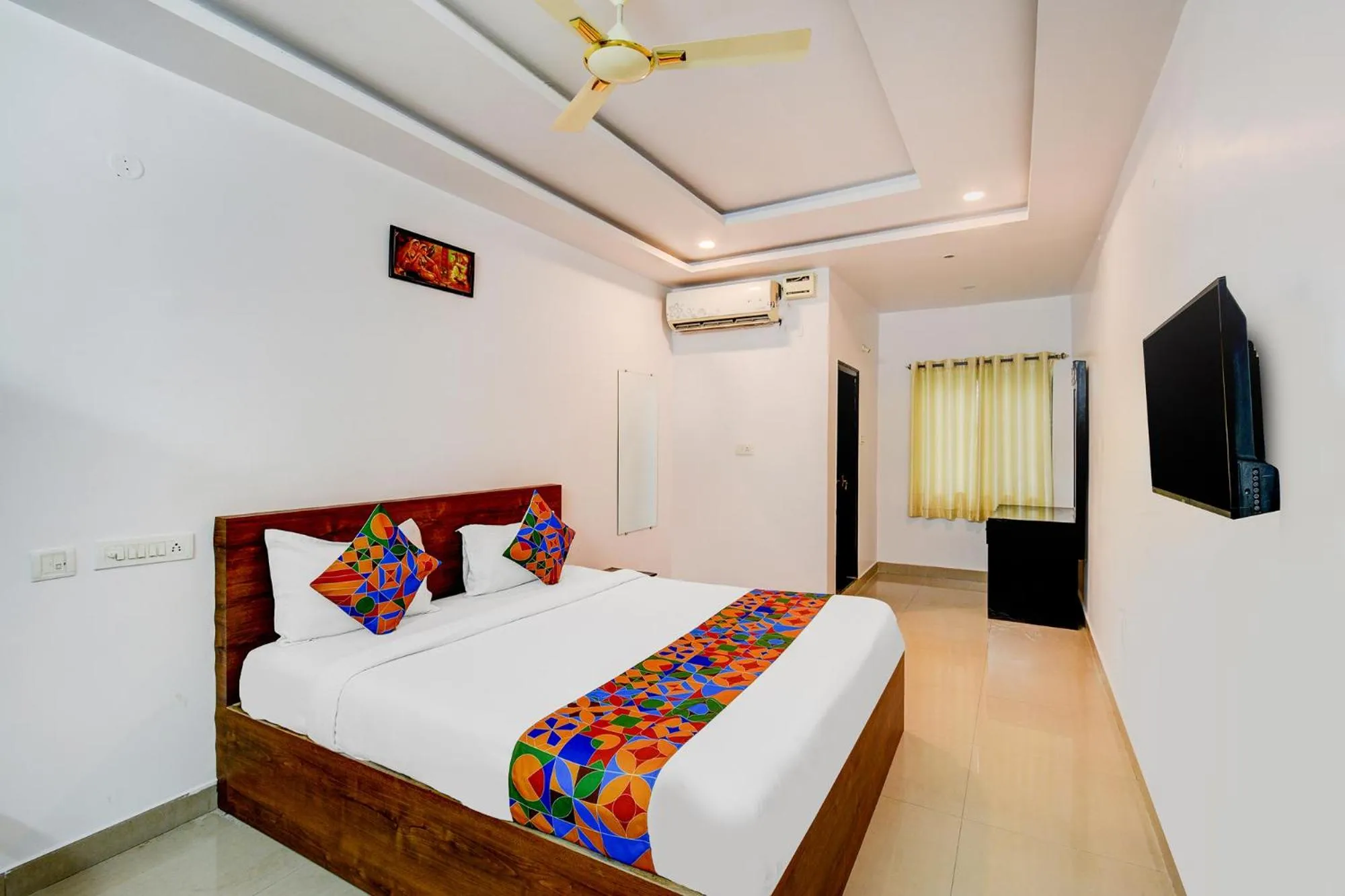 Bed in FabHotel Pushpa Grand
