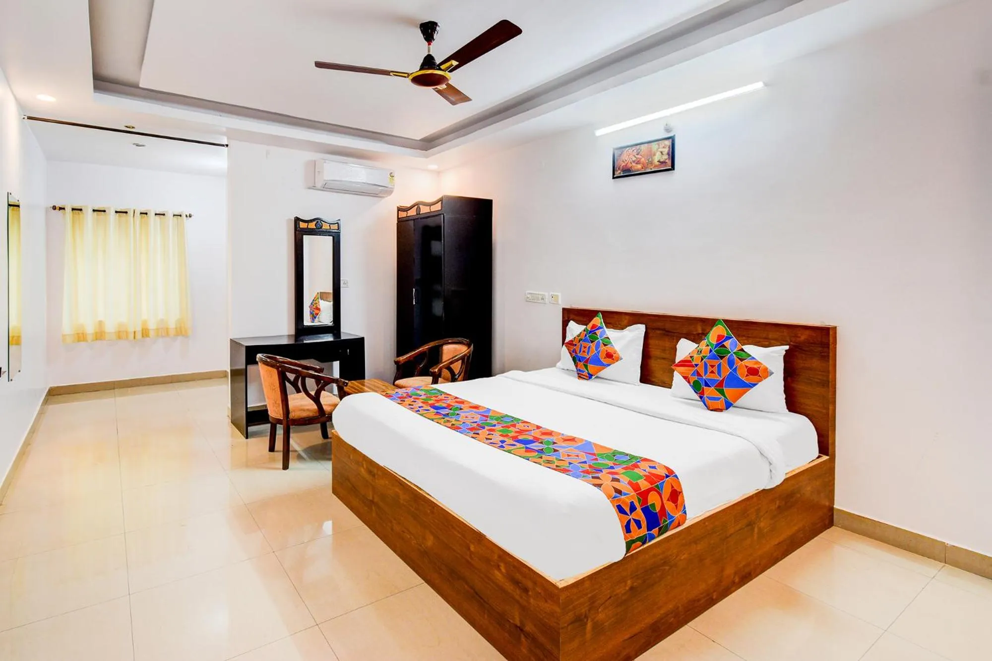 Bed in FabHotel Pushpa Grand